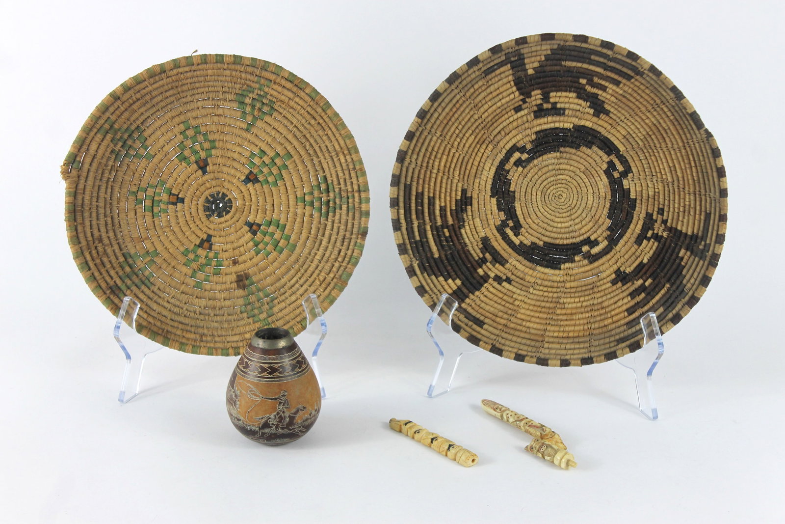 5PC Native American Baskets & Other: Includes a basket with green geometric pattern, a basket with pictorial bird design, two carved bone totems, and a hollow gourd vase depicting a woman and a cowboy wrangling a cow marked "El Lazo." Sm