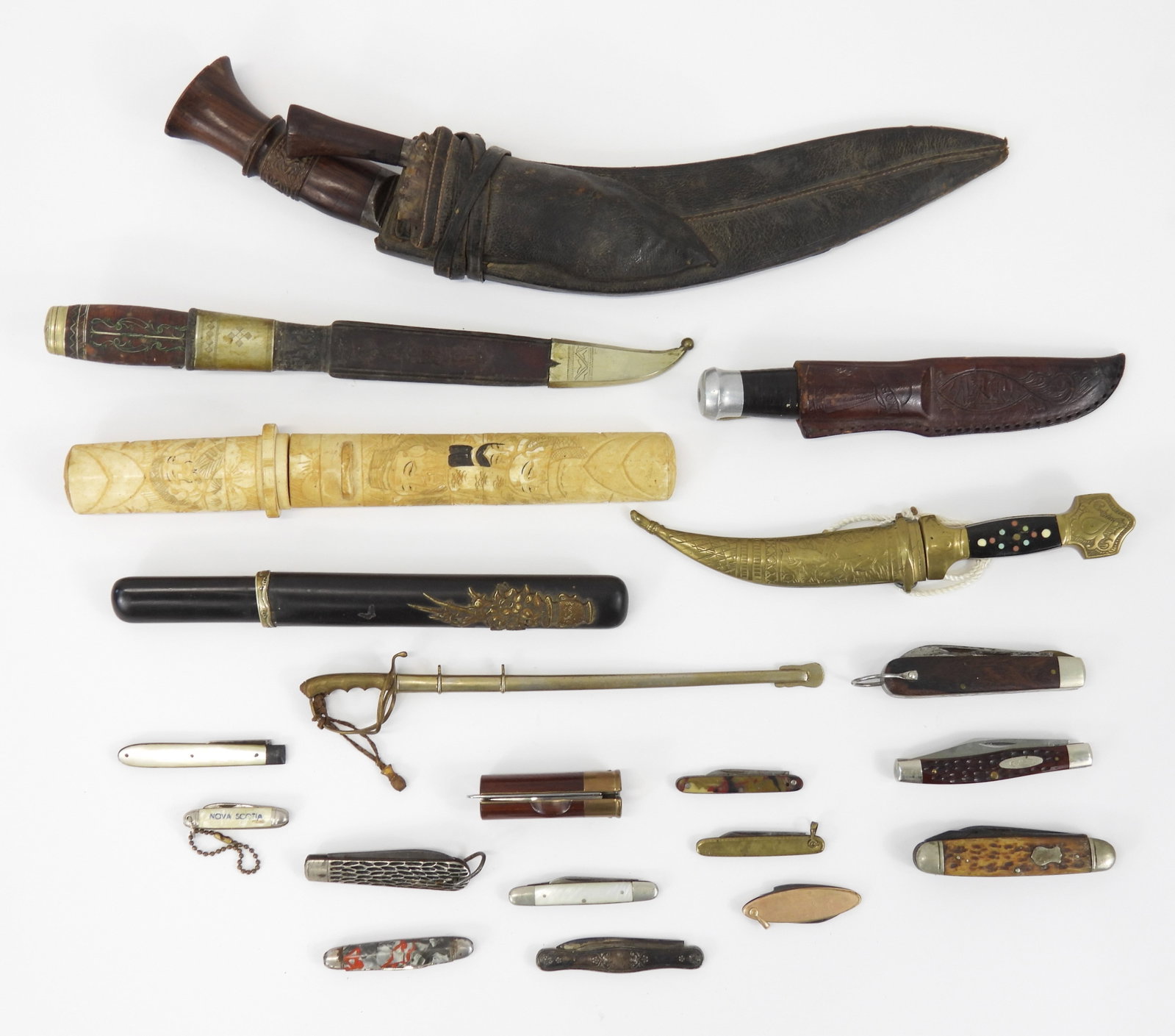 Group of Edged Weapons: A group of edged weapons with an Ames theatrical/fraternal short sword; a Japanese tanto with a bone hilt and scabbard; a Japanese tanto (no tang markings); a U.S. Model 1902 sword letter opener and s