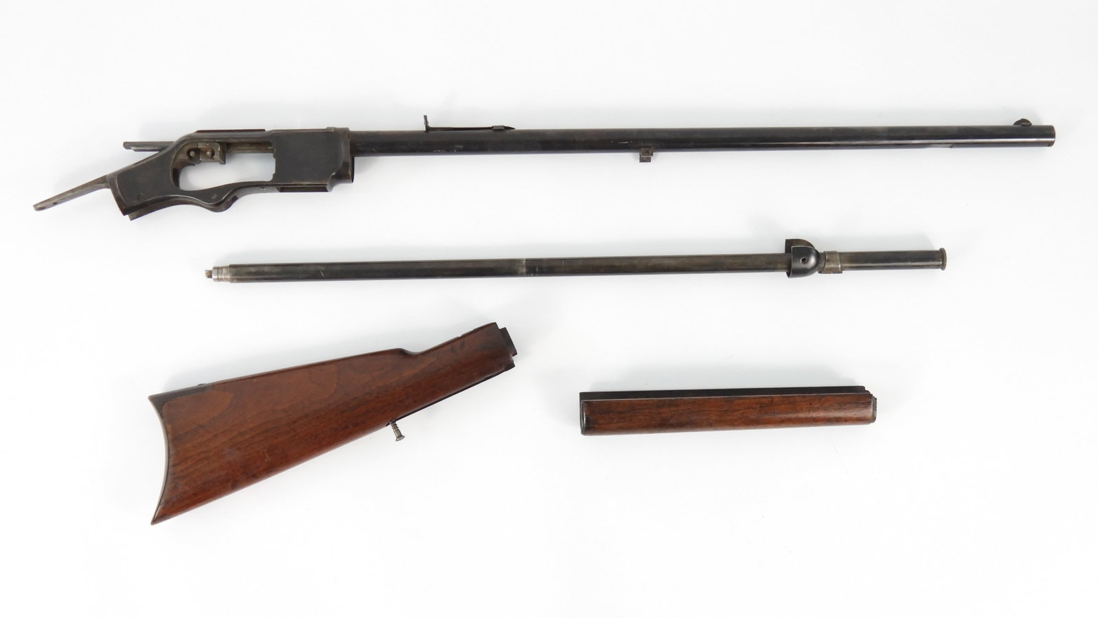 Winchester Model 1873 .22 Short Rifle Parts: Group includes a .22 short round blued barrel marked "WINCHESTER'S -REPEATING-ARMS NEW HAVEN CT./KING'S IMPROVEMENT -PATENTED-MARCH 29. 1866 . OCTOBER 16. 1860.", and ".22 SHORT" on the top of the bar