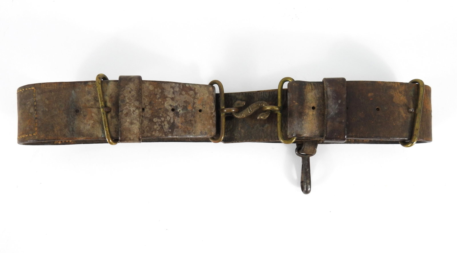 British Snake Buckle Belt: Brown leather belt, brass fittings and snake buckle, with a WWI German steel canteen clip attached.