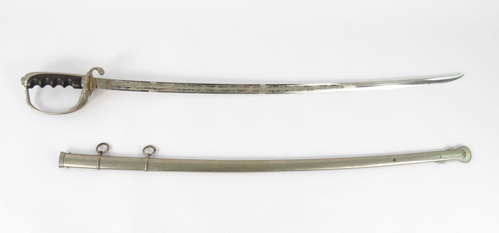 U.S. Model 1902 Army Officer's Sword and Scabbard: Nickel-plated brass hilt, brown bone grip, steel blade marked on one side of the ricasso "A.S.Co./1906" with an ordnance bomb, marked on the other "HARDING/UNIFORM &/REGALIA CO/BOSTON,/MASS.", blade e