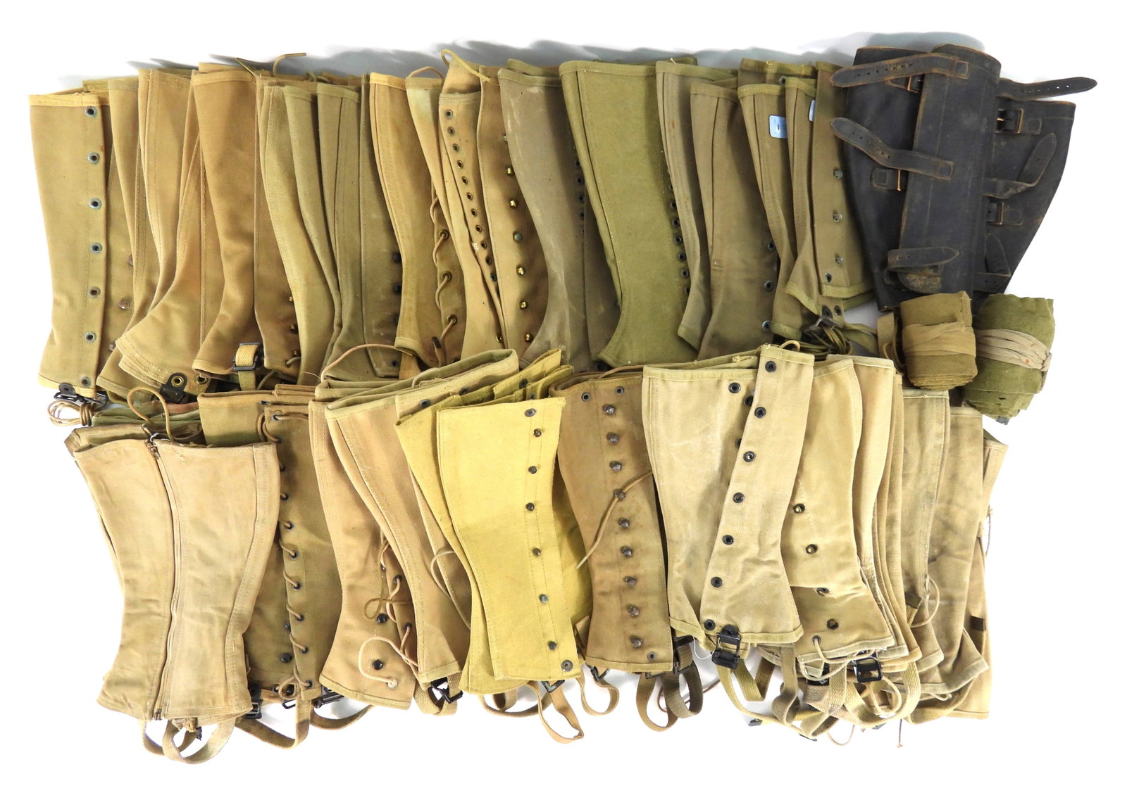 large Group of Army, USN, and USMC Leggings: Large group of canvas leggings, a pair of leather leggings, and some spare laces.