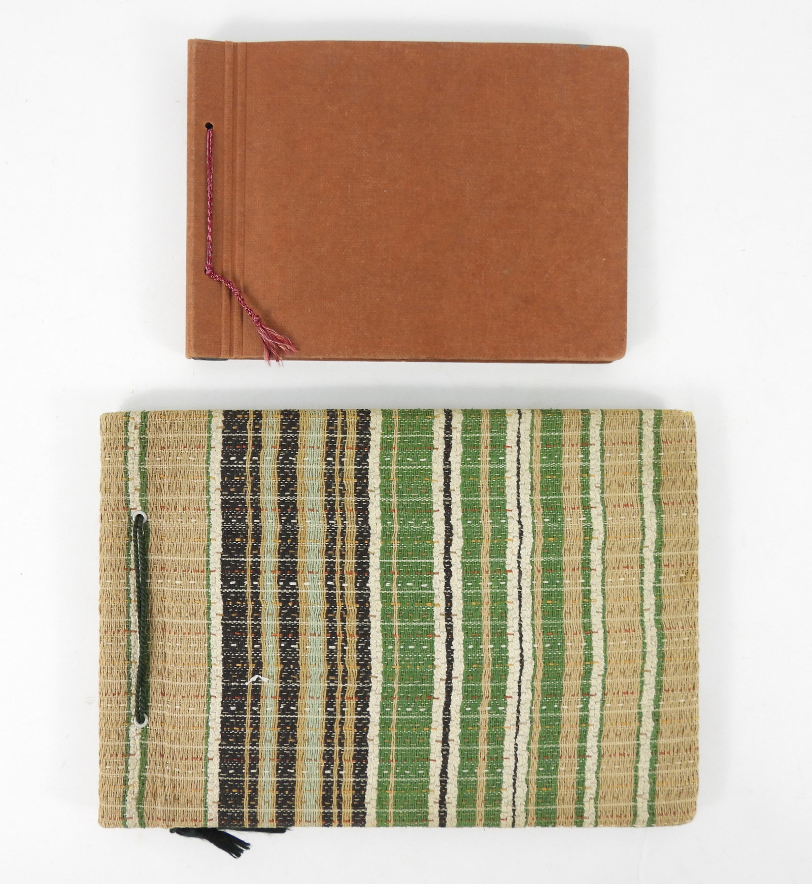 Two WWII German Photo Albums: An album with approximately 97 photos depicting infantry units in combat, an SS machine gun squad, wounded men, crossing rivers, artillery, damaged planes, tanks, and captured French prisoners; and an