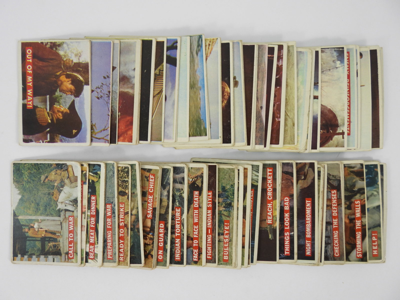 94PC 1956 Topps Green & Orange Davy Crockett Cards: Orange back cards include numbers 2, 4-6, 8-10, 15, 19-29, 31, 33-35, 38-40, 43-45, 50-52, 55, 57, 58, 60, 61, 63-69, 72, 77, 79, and 80. Green back cards include number 4A, 6A, 12A-15A, 20A, 23A, 31A