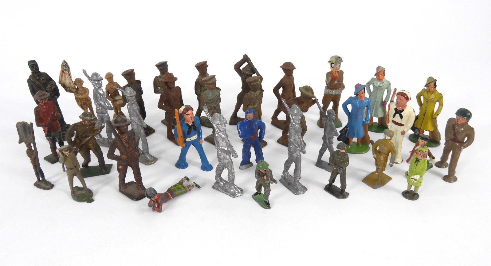 Collection of Tin & Other Metal Soldiers & Figures: Collection of various soldiers and civilian figures crafted out of various metals from the early to mid 20th Century. From the collection of a Northboro, Massachusetts estate.