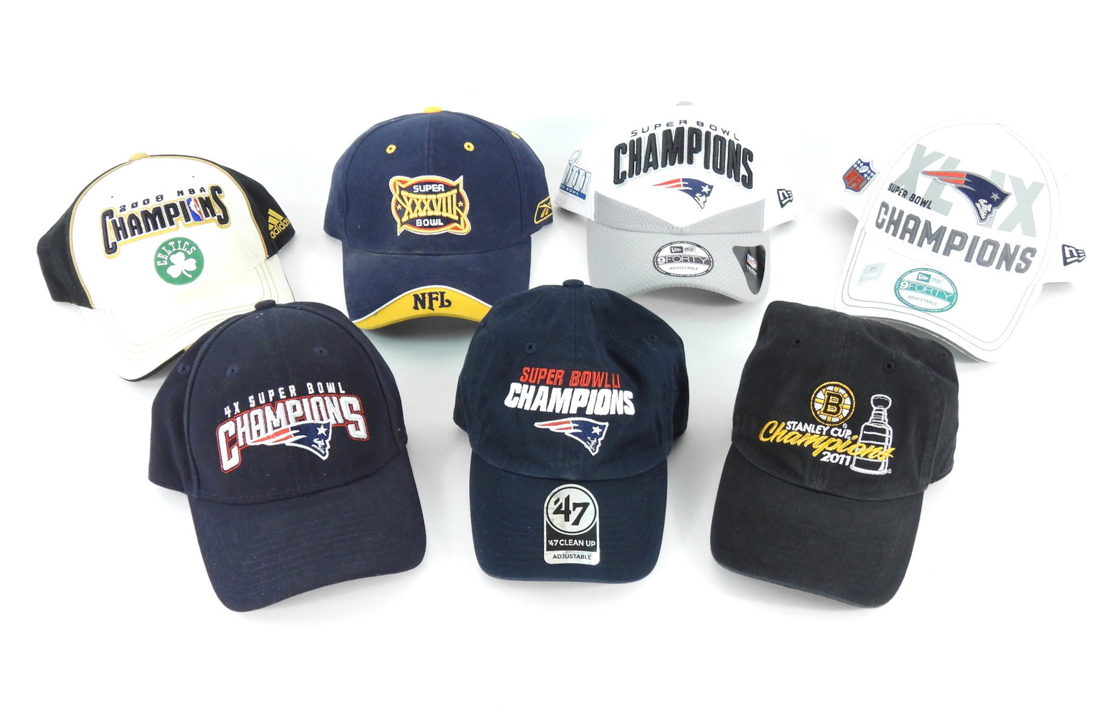 7PC Patriots Celtics & Bruins Championship Hats: Includes a 2008 MBA Champions Celtics hat, a Super Bowl XXXVIII hat, a Super Bowl LIII hat, a Super Bowl XLIX hat, a Patriots 4x Super Bowl Champions hat, a Super Bowl Champions LI hat, and a 2011 Bru