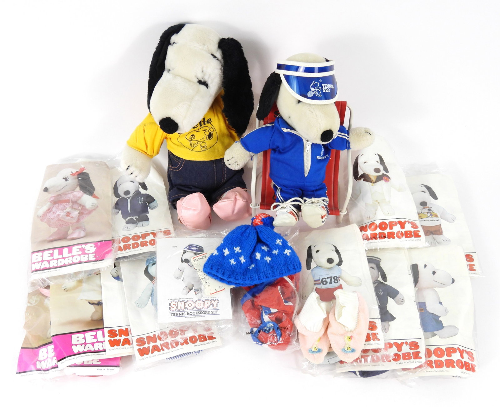 United Film Syndicate Belle & Snoopy w/ Costumes: Includes a 1968 United Feature Syndicate, Inc. Belle and a 1968 United Feature Syndicate, Inc. Snoopy plush doll with chair and an assortment of doll costumes. From the collection of a Needham, Massac
