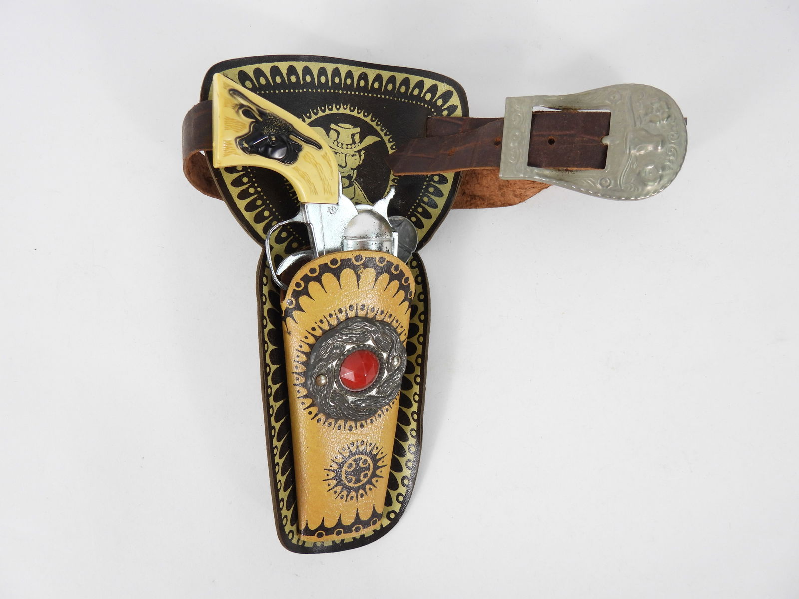 Hubley Black Steer Cap Gun w/ Holster: Includes a Black Steer Head cap gun with holster emblazoned with a cowboy. From the collection of a Northboro, Massachusetts estate.