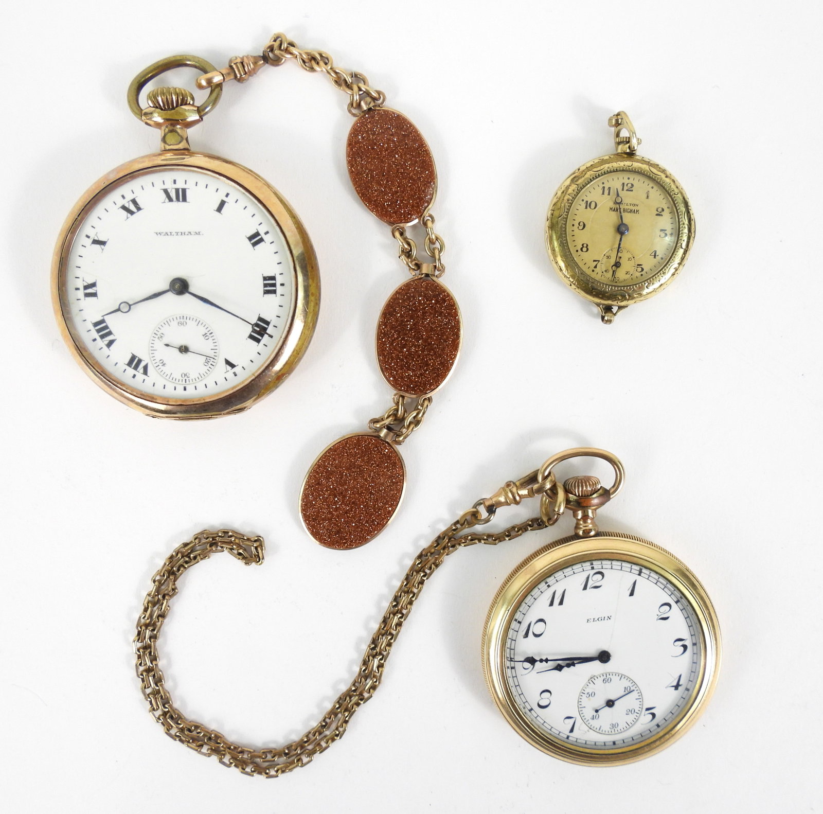 3PC Elgin Waltham Hamilton Pocket Watches: United States, Circa 1920's. Includes a Hamilton detachable wristwatch with black Arabic numeral numbering and blued hands, an Elgin pocket watch with black Arabic numeral numbering in open face case,
