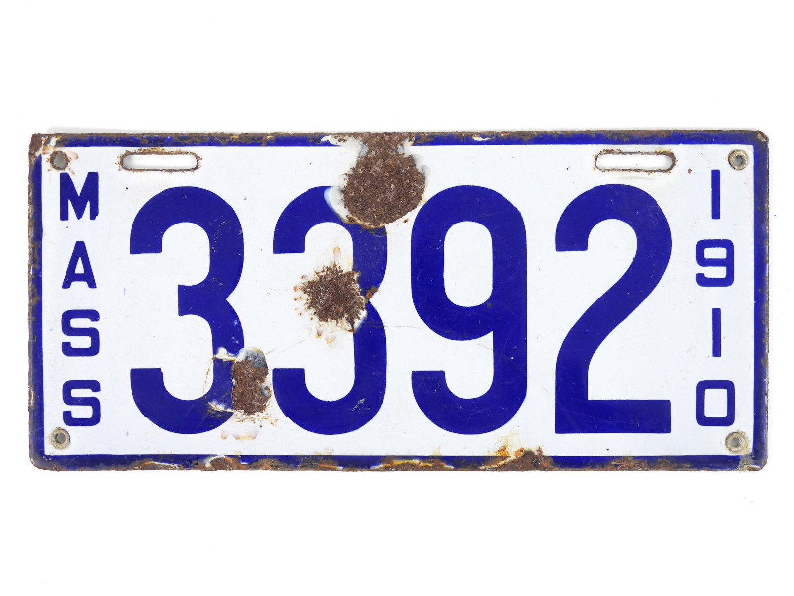 1910 Massachusetts Porcelain License Plate: Desirable low number white and blue four digit 3392 car / vehicle license plate made by the Baltimore Enamel & Novelty company Baltimore Maryland. From a Concord Massachusetts estate. 5 1/2" x 12"