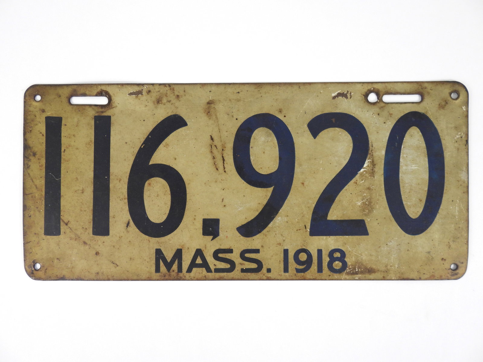 1918 Massachusetts License Plate: White and blue six digit 116920 car / vehicle license plate with a green color reverse. An extra hole was added for mounting this plate. From a Concord Massachusetts estate. 6 1/2" x 14 1/2"