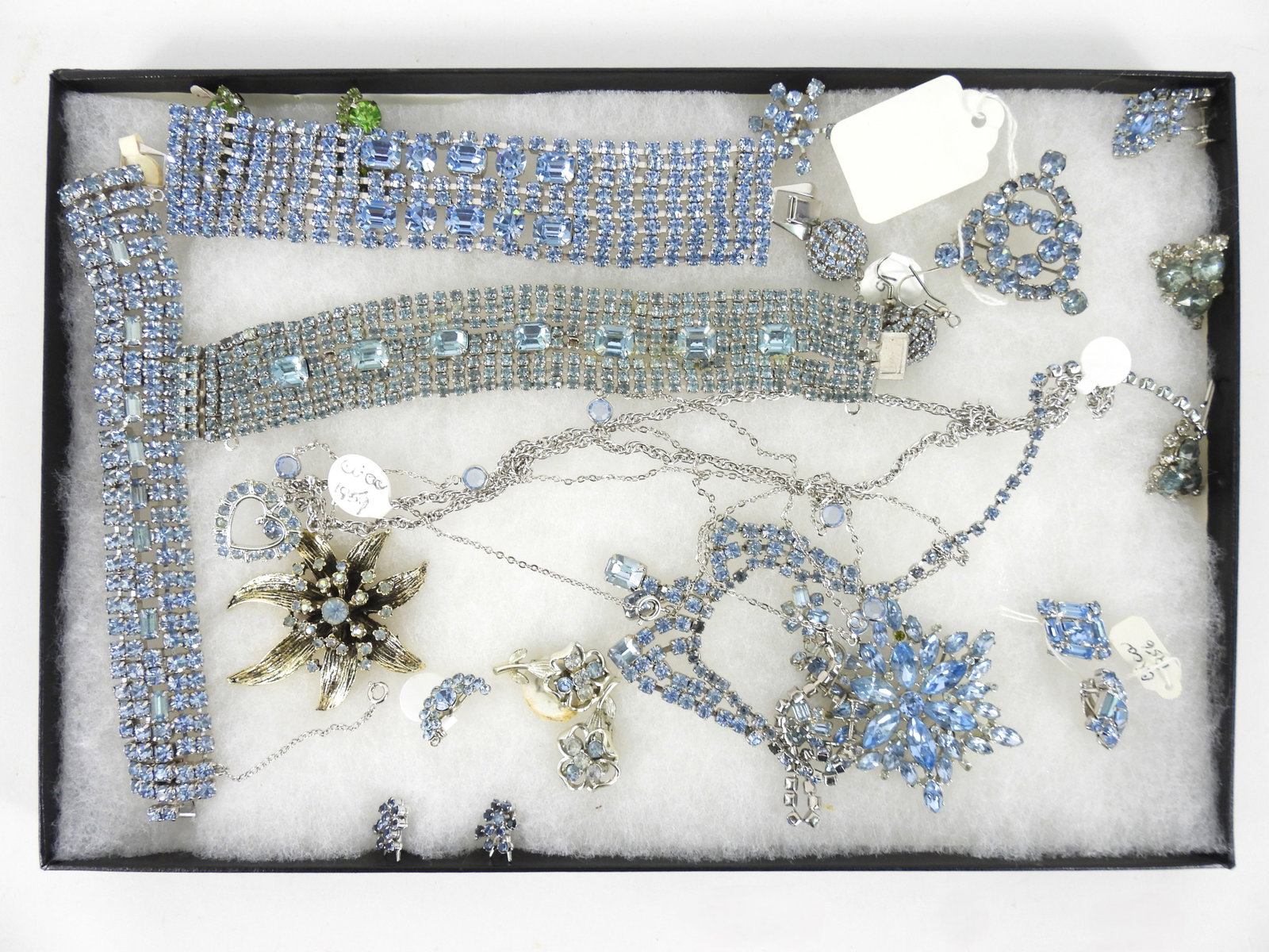 Collection MCM Blue Rhinestone Costume Jewelry: United States, 20th Century. Collection of icy blue rhinestone jewelry including clip on earrings, bracelets, necklaces, and brooches. From the collection of a Marlborough, Massachusetts estate. Bracl
