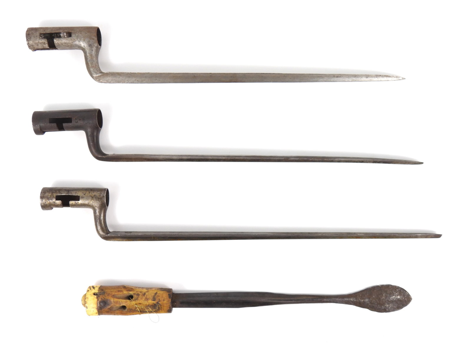 Four Early 19th Century Socket Bayonets: A socket bayonet marked with a dot on the base of the blade and "W/2/23" on the socket; a bayonet made into a tool with a bone handle; a bayonet marked "US/EB" on the base of the blade; and an unmarke