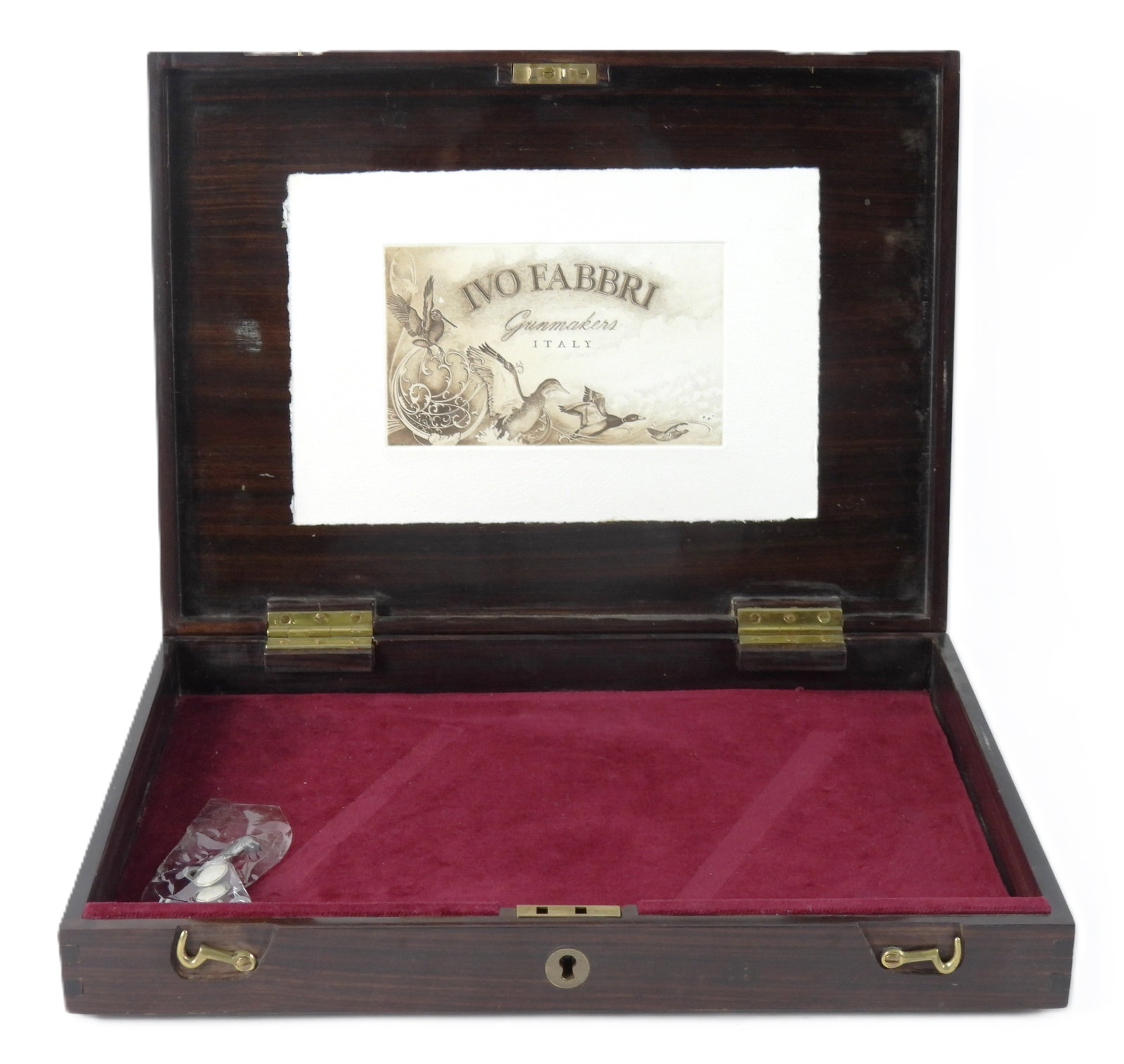 Italian Ivo Fabbri Walnut Gun Case: Walnut case with brass hook latches on the front and keyed lock (two keys inside the case), a maroon velvet liner, and a label inside the lid marked "IVO FABBRI/gunmakers/ITALY". 14 5/8" x 10 3/4" x 2