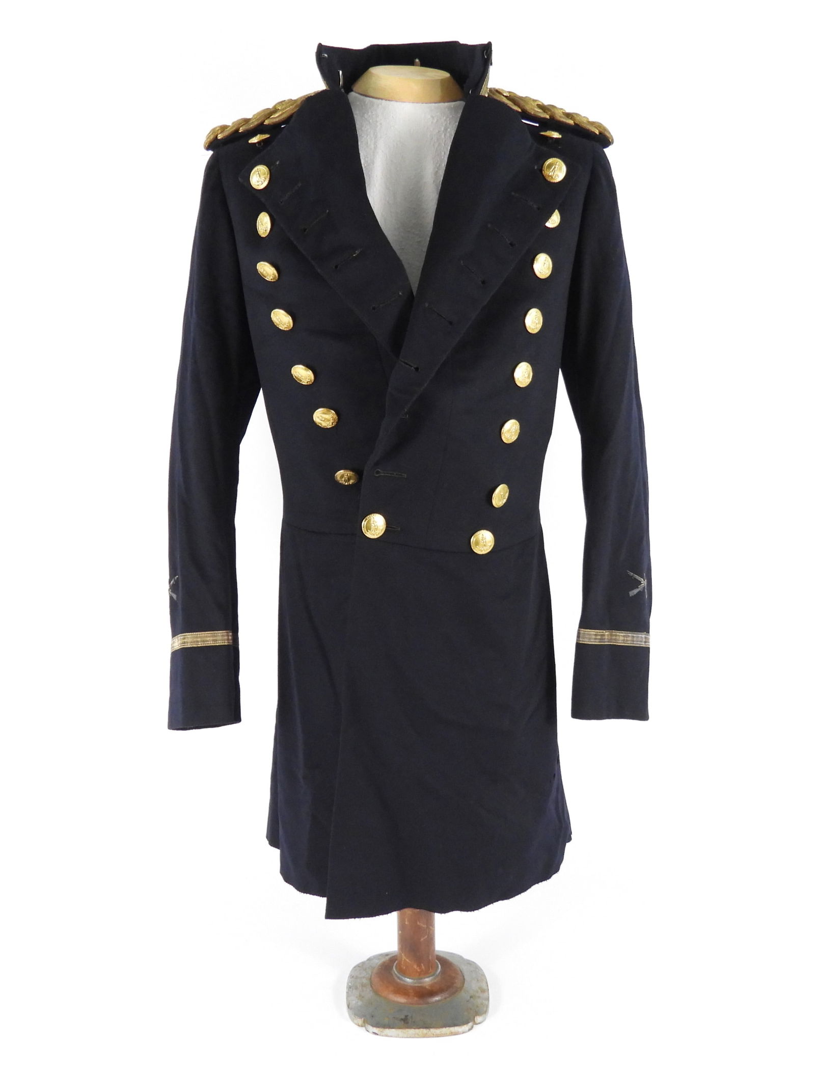 Virginia Double Breasted Frock Coat: Dark blue broadcloth body, metallic tape around the collar and cuffs, brass Virginia buttons, embroidered crossed rifles and "1" on each sleeve near the cuff, knotted epaulets on each shoulder, black