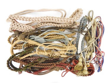 Large Group of Fourragere's and Hat Cords