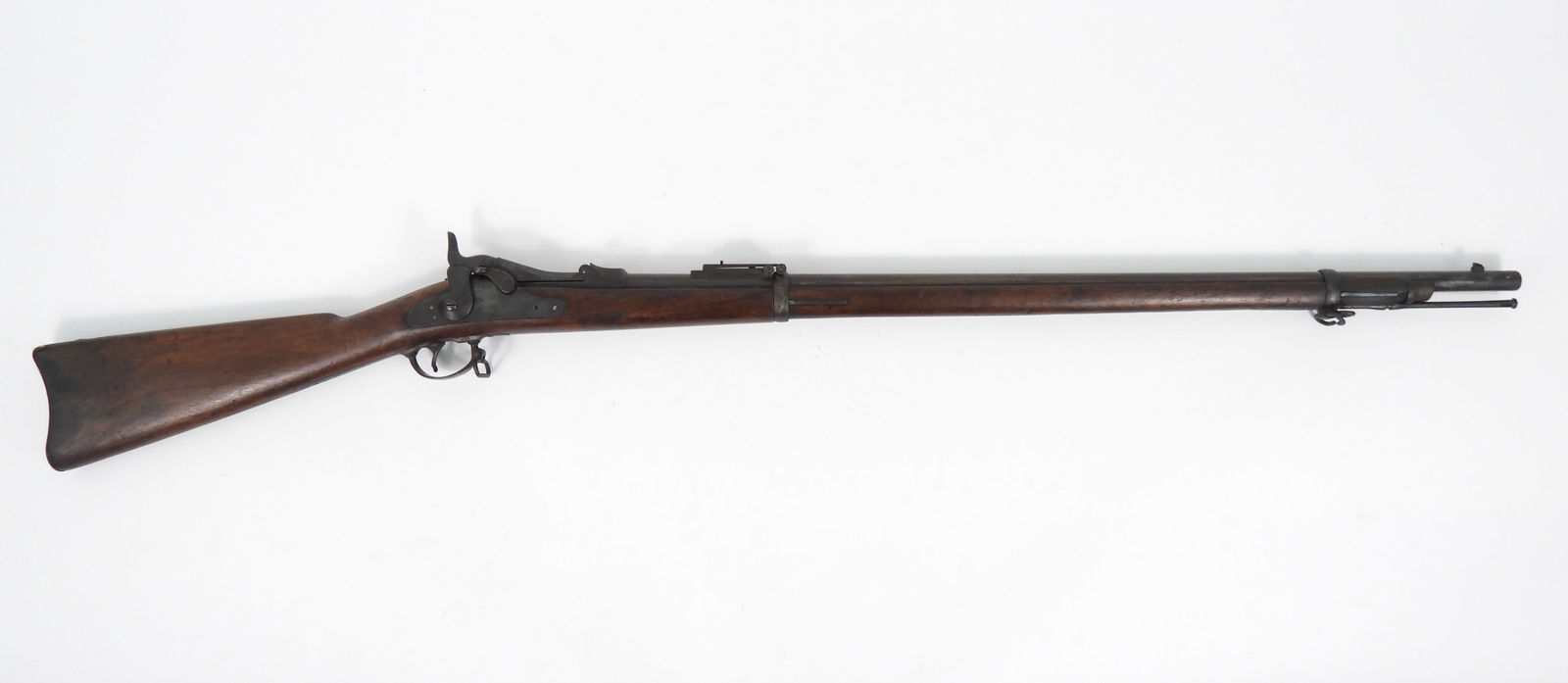 US Model 1873 Trapdoor Springfield Rifle: .45-70-caliber, serial number 390710, walnut stock, steel fittings. lock marked with an eagle and "U.S./SPRINGFIELD", breech block marked "U.S/MODEL/1873", breech marked with an eagle head and "V/P",