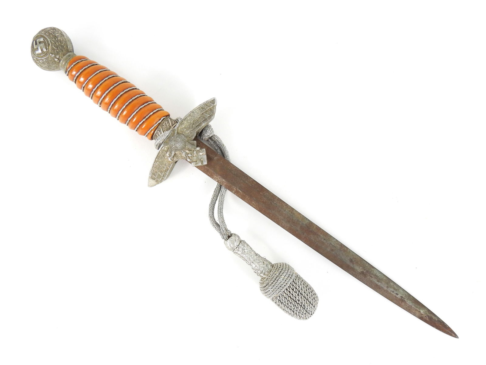 WWII German Army Dagger and Knot: Aluminum pommel with oak leaves and a swastika, brown Bakelite grip with silver wire wrap, aluminum guard with an eagle and swastika, a steel blade, and a silver dagger knot. Blade lg. 10 1/4", Overal