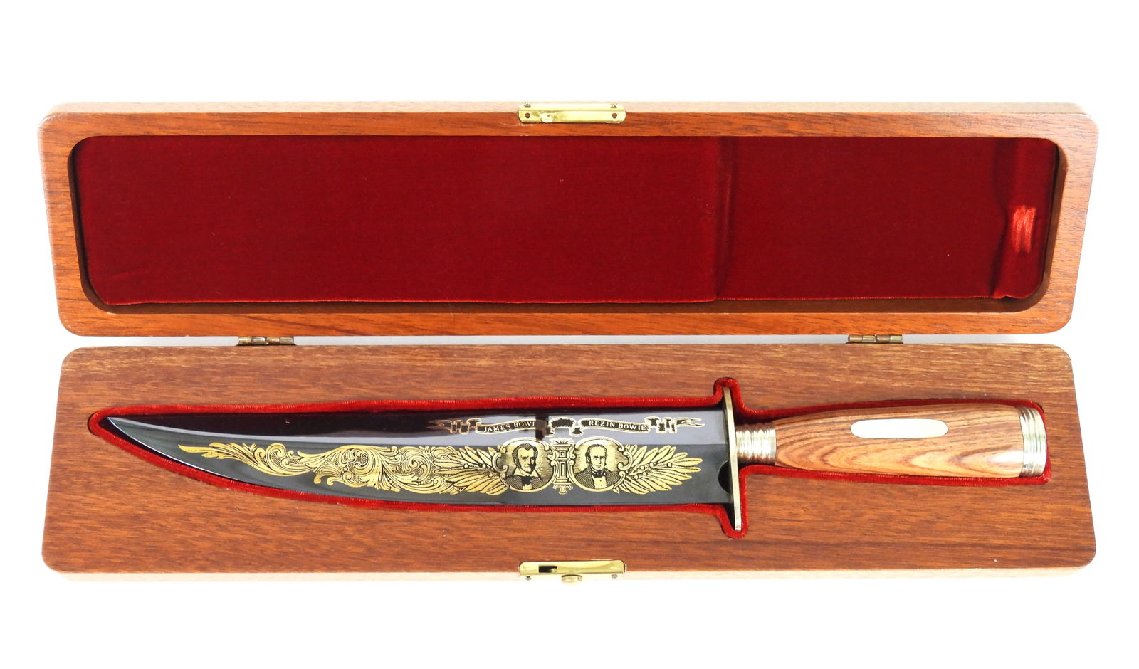 James & Rezin Bowie Cased Commemorative Knife: Metal. Stored in a in wood case with red felt liner. Inscribed on blade with Gold gilt "Vidalia Sandbar" on one side of blade and "James Bowie Rezin Bowie" with their portraits on the other. The overa