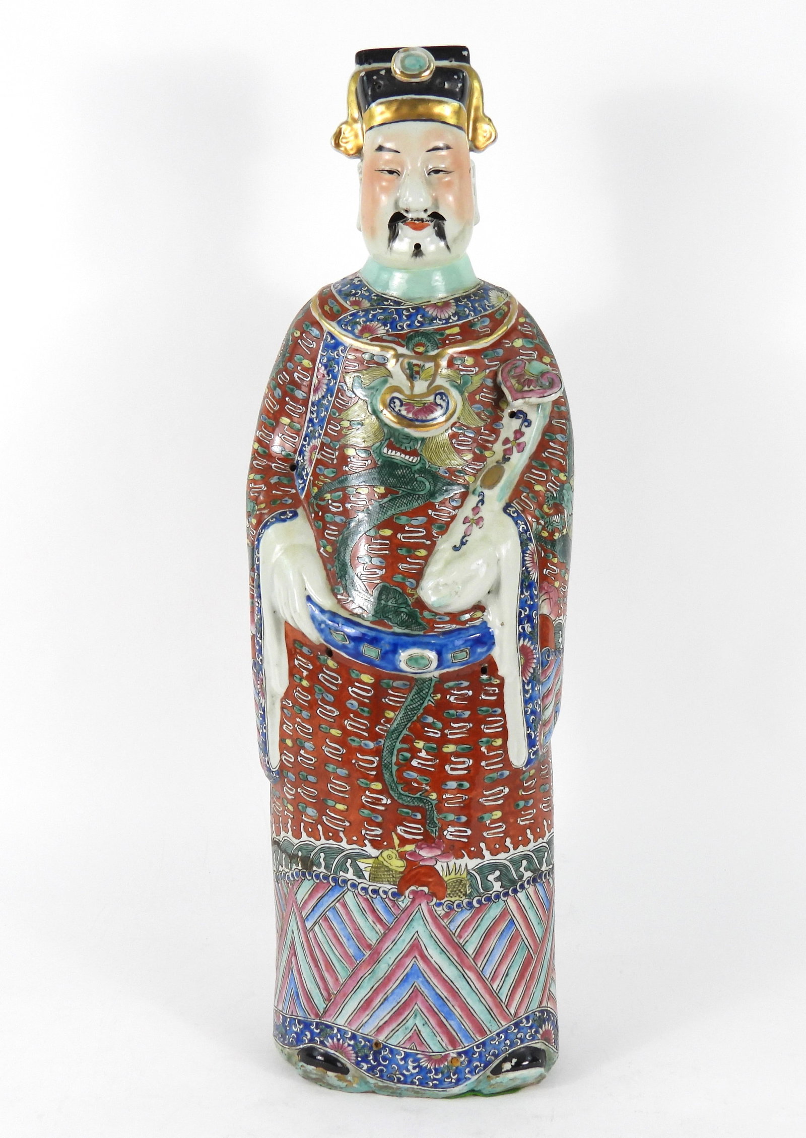 Chinese Lu Xing Porcelain Sculpture: China, Early 20th Century, Porcelain. Tall figure of Lu Xing, god of prosperity, dressed in red robes decorated with four toed dragons. The sculpture at one time most likely had horse hair forming the