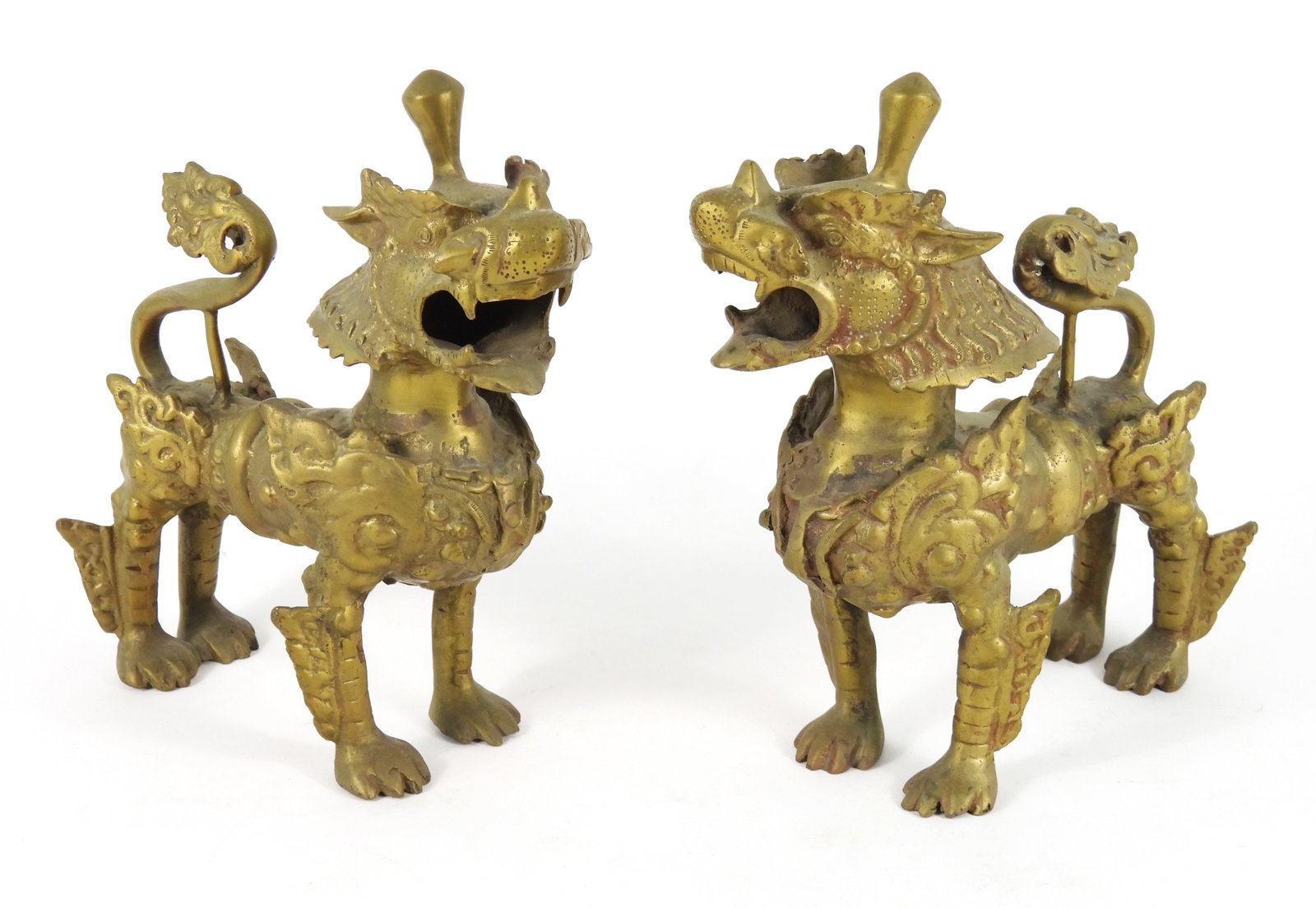 2PC Tibetan Brass Foo Dogs: Tibet, Early 20th Century, Brass. Pair of standing foo dogs with bared teeth and curled tails. From the collection of a Mattapan, Massachusetts estate.