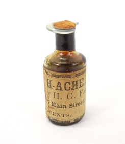 Small Early Paper Labeled Medicine Bottle