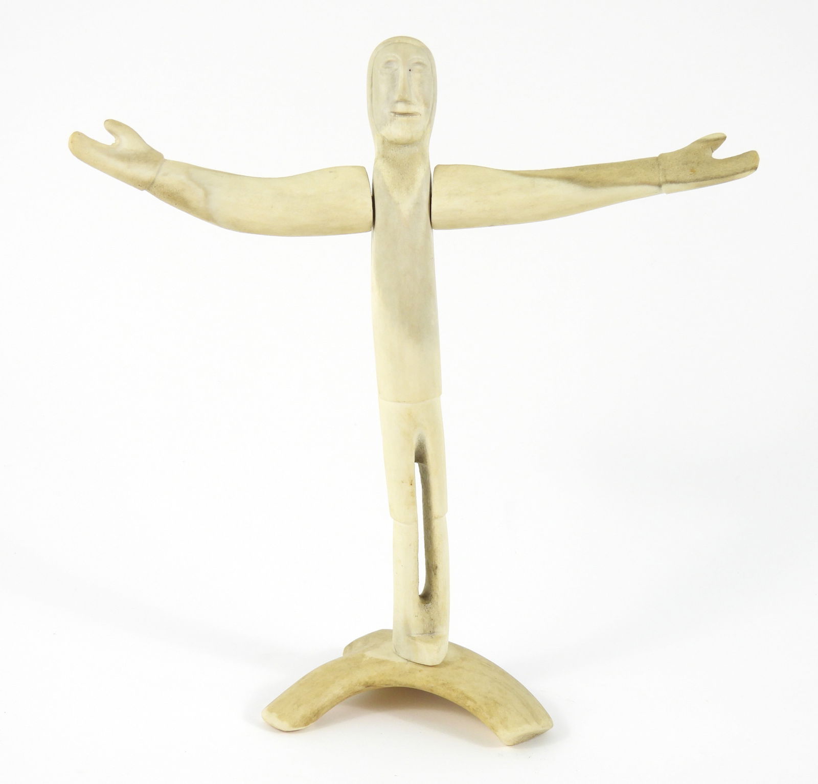 Inuit Carved Caribou Antler Figure Sculpture: North America, 20th Century, Bone. Carved antler depiction of a standing man with arms outspread. From the collection of a Princeton, Massachusetts estate.