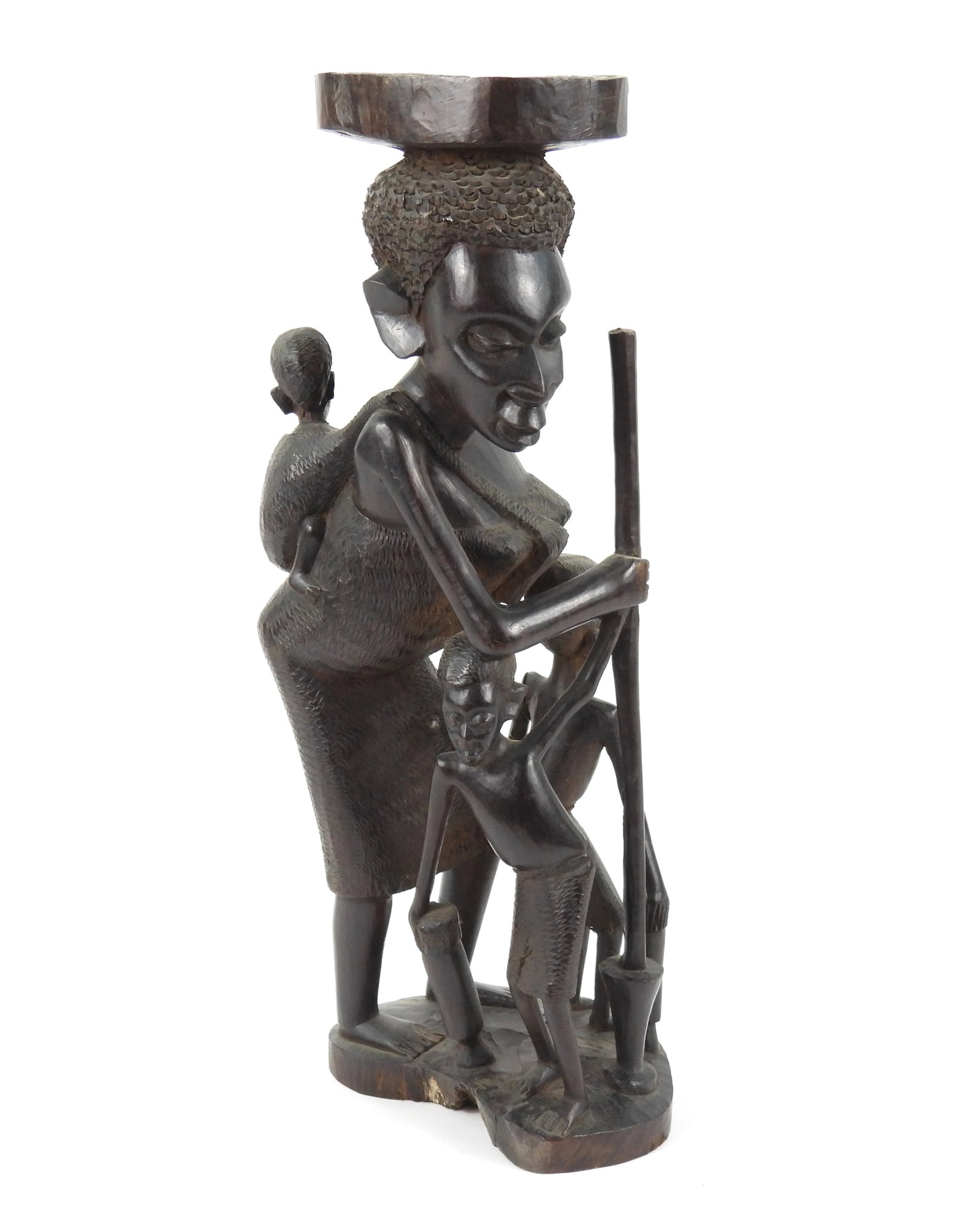 African Carved Wood Mother & Children Sculpture: Africa, 20th Century, Wood. Depicts a woman with two children at her feet and a baby slung on her back. From the collection of a Princeton, Massachusetts estate.