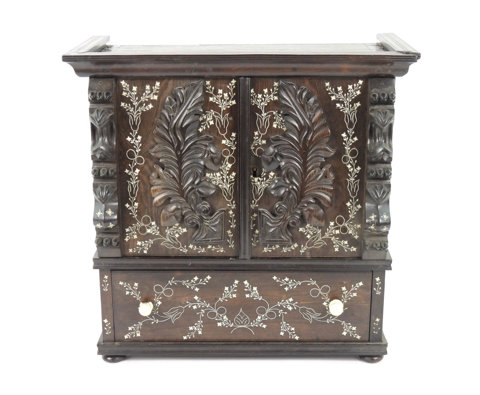 Anglo-Indian Inlaid Table Cabinet: India, Late 18th-Early 19th Century, Wood, bone. Table top cabinet with two doors and one drawer with all over botanical inlay decoration. From the collection of an Agawam, Massachusetts estate.