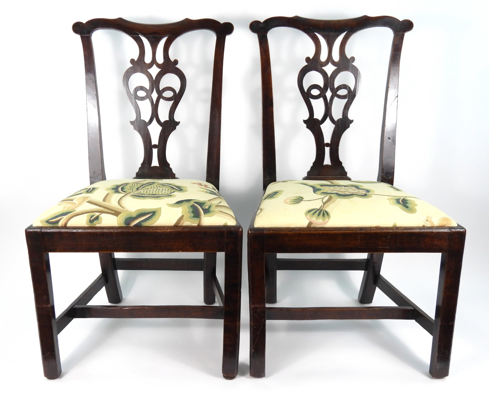 18C Pair Chippendale Owl Eye Chairs: 18th Century, Wood. Matching pair with re-upholstered seats. Non peg construction with quarter bead leg and seat frame edges. Chamfer edges to rear of back uprights. These may be Rhode Island made cha