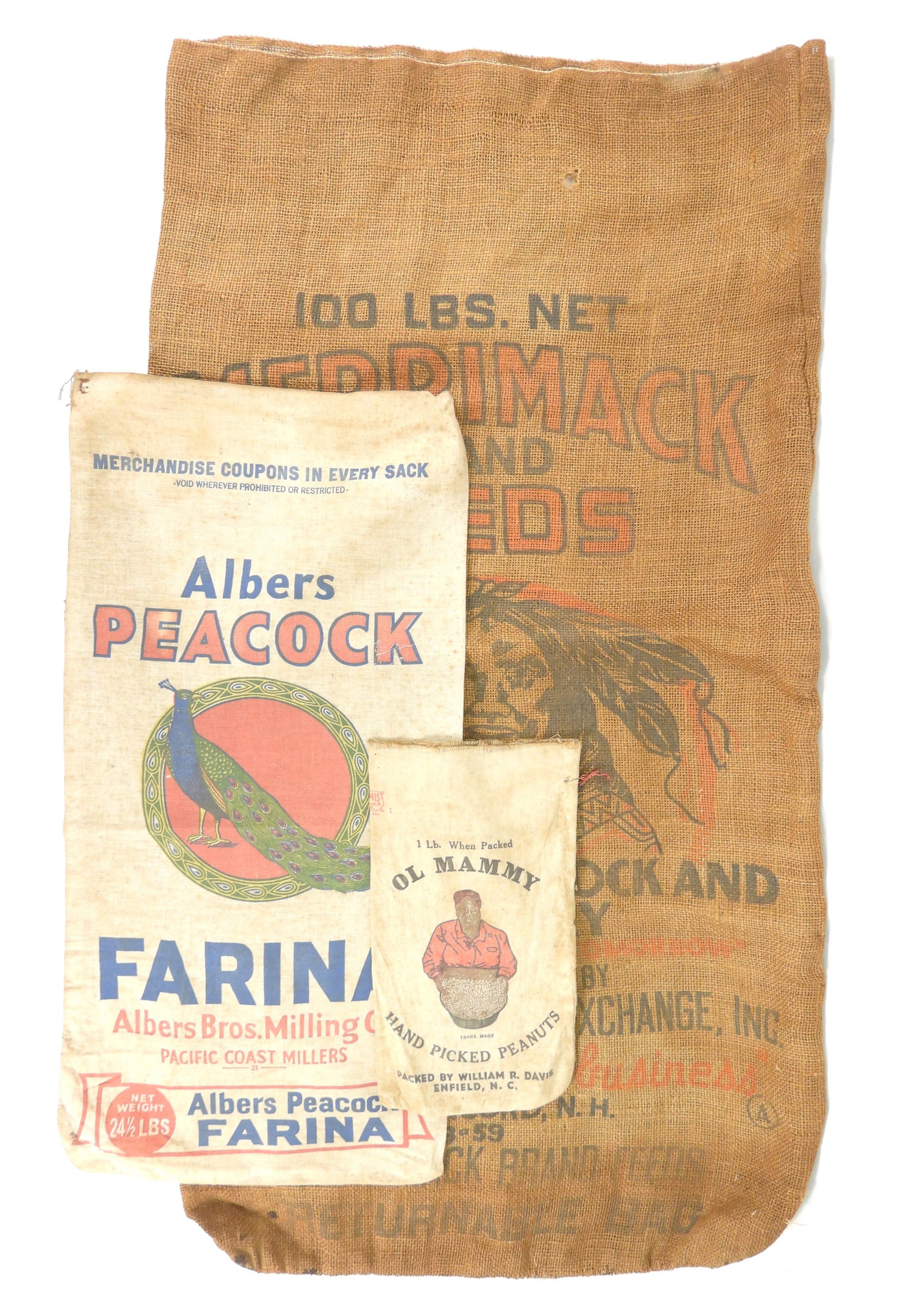 3PC Antique Burlap & Other Peanut & Grain Sacks: United States, Early 20th Century, Textile. Includes an Albers Peacock Farina sack, an Ol Mammy Hand Picked Peanuts sack, and a 100lbs Merrimack Brand Feeds burlap sack. Smallest 12" x 6 3/4", Largest