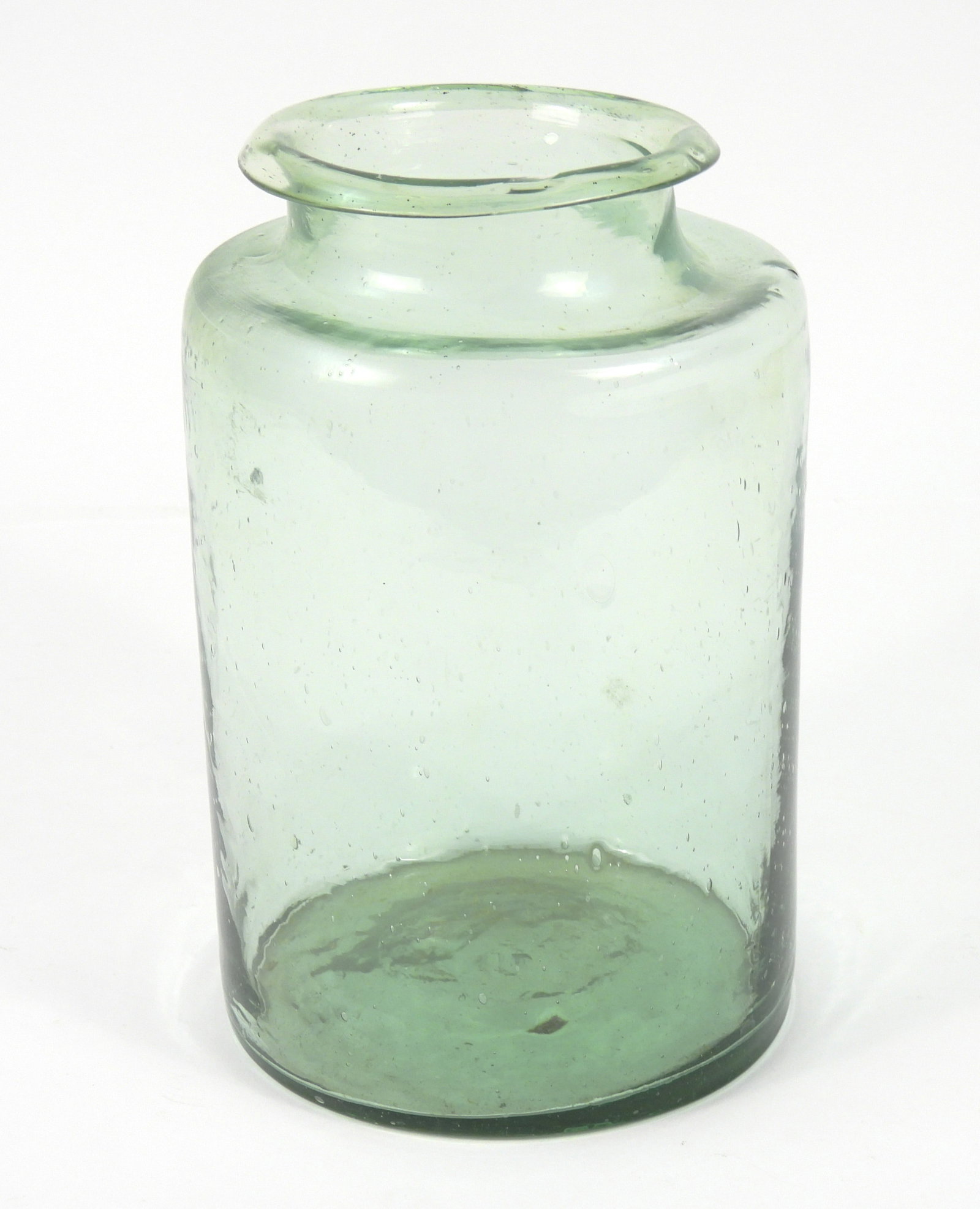 LG Early Wide Mouth Rolled Edge Jar: 19th Century, Glass. Nice light Green color with large pontil scar. Very active blown glass. Please study photos to understand condition. 8 1/4" x 5 1/4" dia.