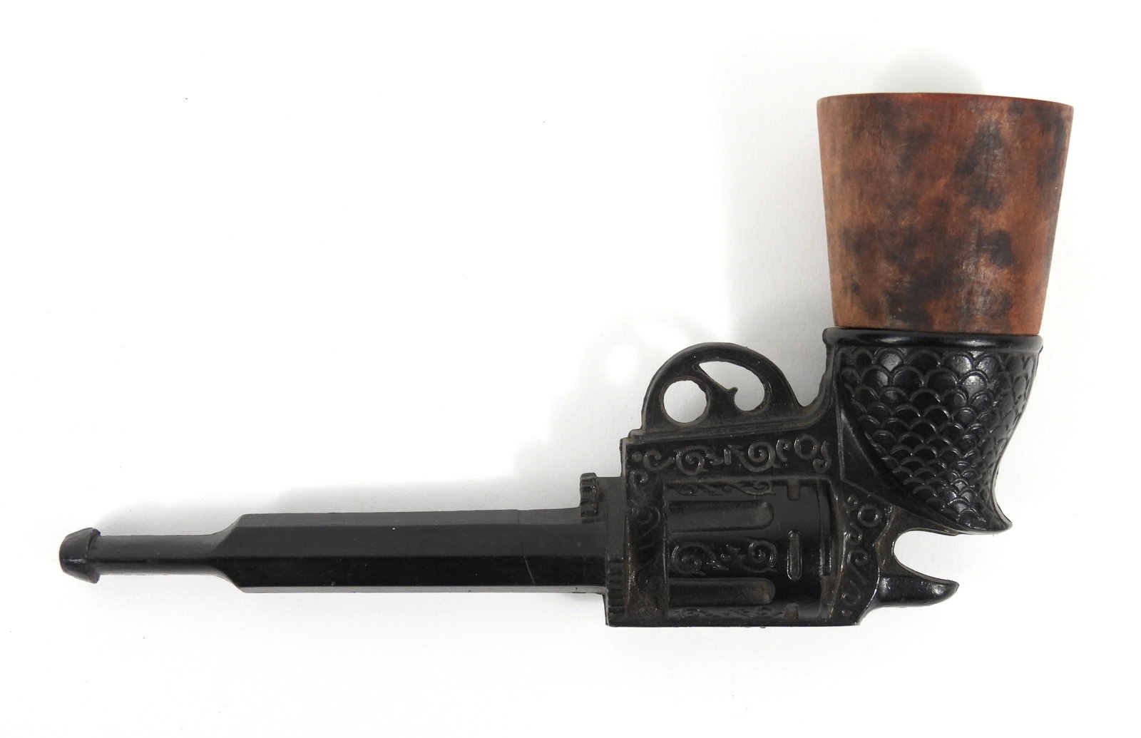 Revolver Shaped Tobacco Pipe: 19th Century. Bowl unscrews and is in the form of a Colt or Remington Revolver. Measures 2 3/4" x 5 1/2" long