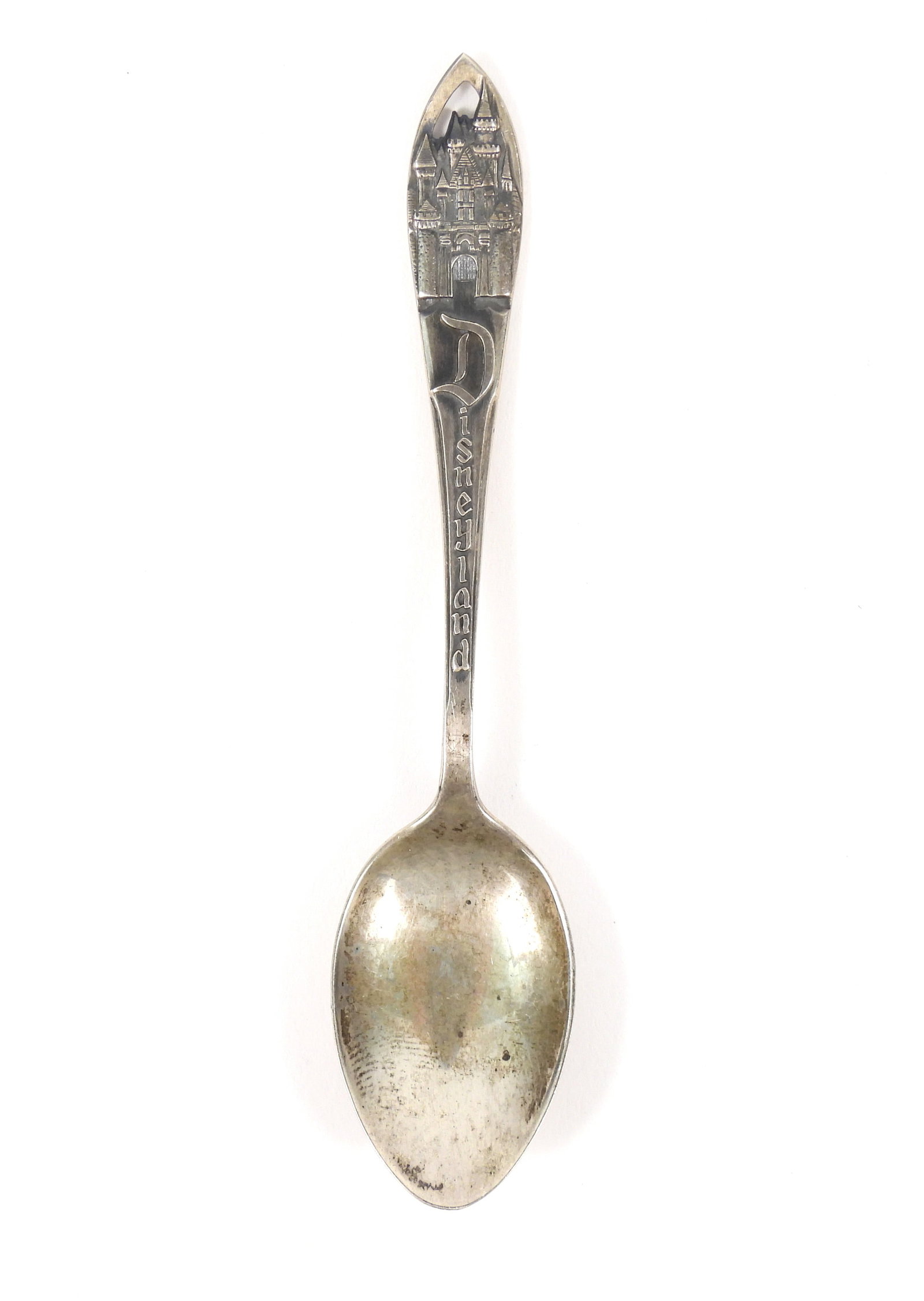 Mid Century Sterling Silver Disneyland Spoon: United States, Circa 1950s, sterling silver. Sterling silver souvenir spoon featuring Sleeping Beauty's castle. Weight as sits .32ozt. Approx. 4 1/8" long.