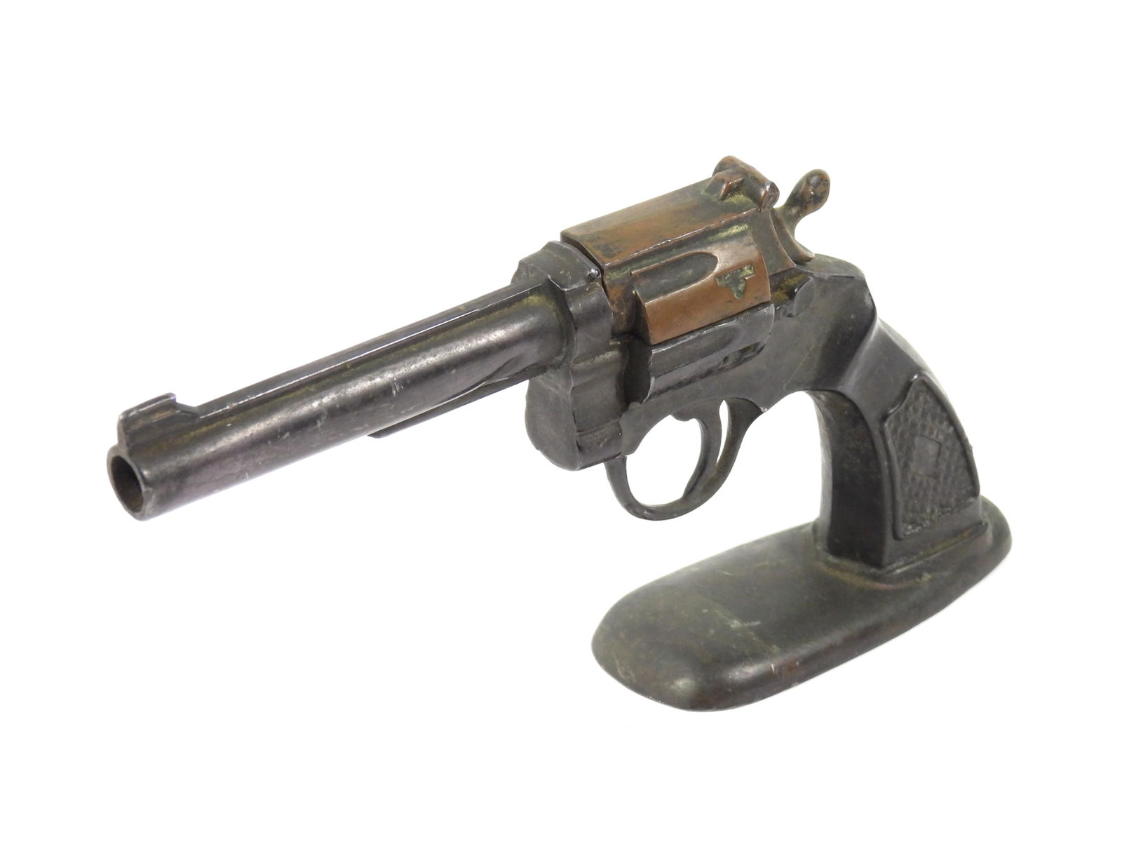 Antique Metal Revolver Cigarette Lighter: Mid 20th Century, Pot metal, brass. Colt style gun lighter that stands on its own. Top of frame opens up to expose a lighter element. 4" x 7 1/2"