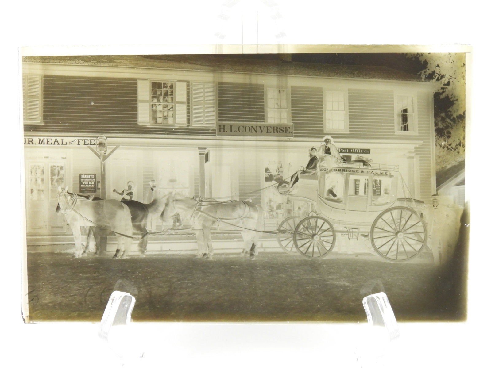 Antique Massachusetts Town Glass Negative: Massachusetts, Late 19th-Early 20th Century, Glass. Depicts a horse drawn carriage in front of a store front marked "Southbridge & Palmer." 5" x 8"