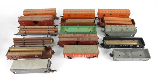 16PC American Flyer S Gauge Trains: United States, Mid-Late 20th Century, Metal, plastic. Sixteen various vintage plastic and metal rail cars, including some with accessory logs. Trains feature different types of coupler hitch systems a