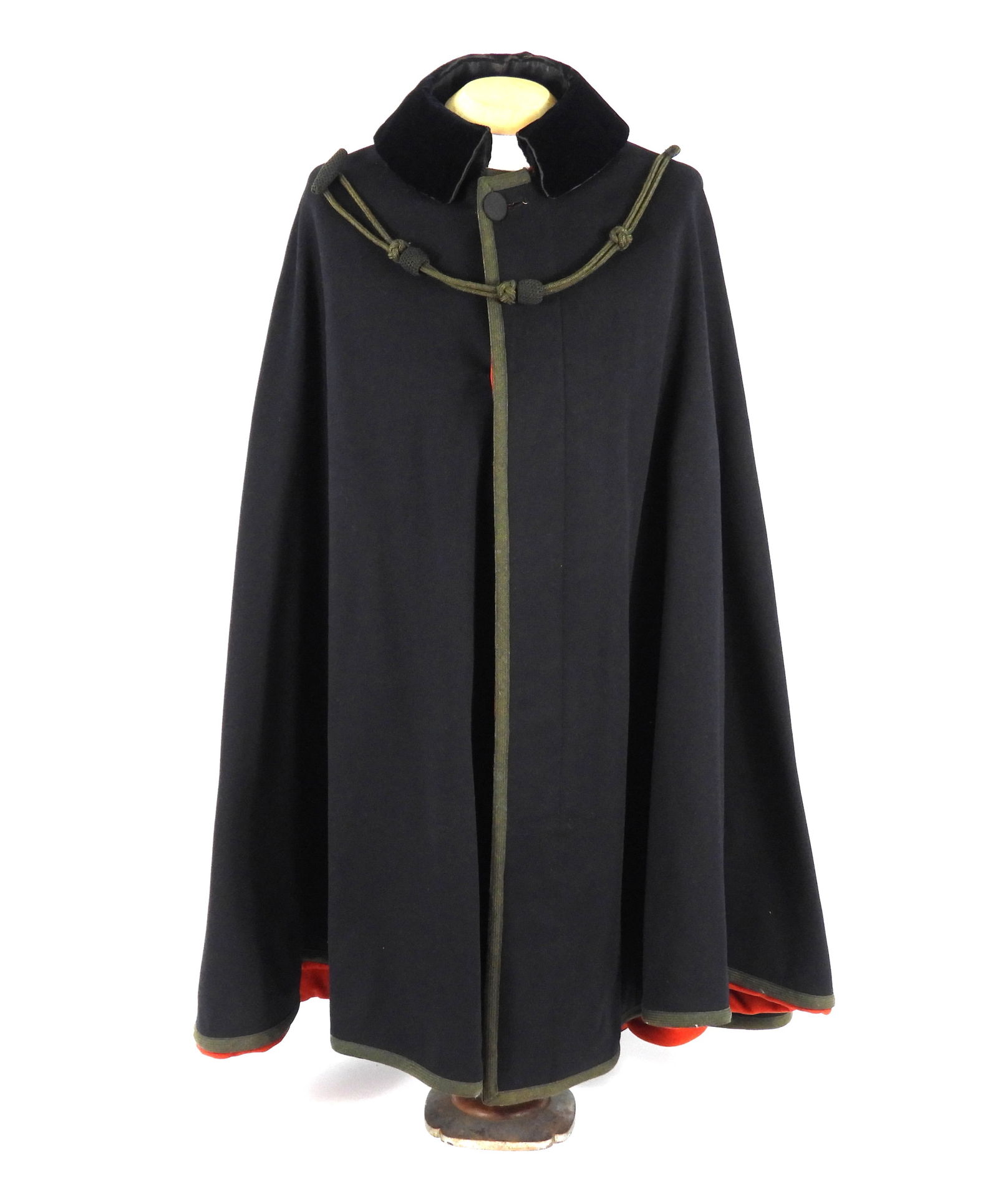 USMC CIRCA 1909 ID'd Boat Cloak: United States, 1909. USMC navy blue wool boat cloak with half inch mohair tape around the perimeter, dark blue velvet detachable collar with a single hook and eye closure (hook is missing), and 3 one