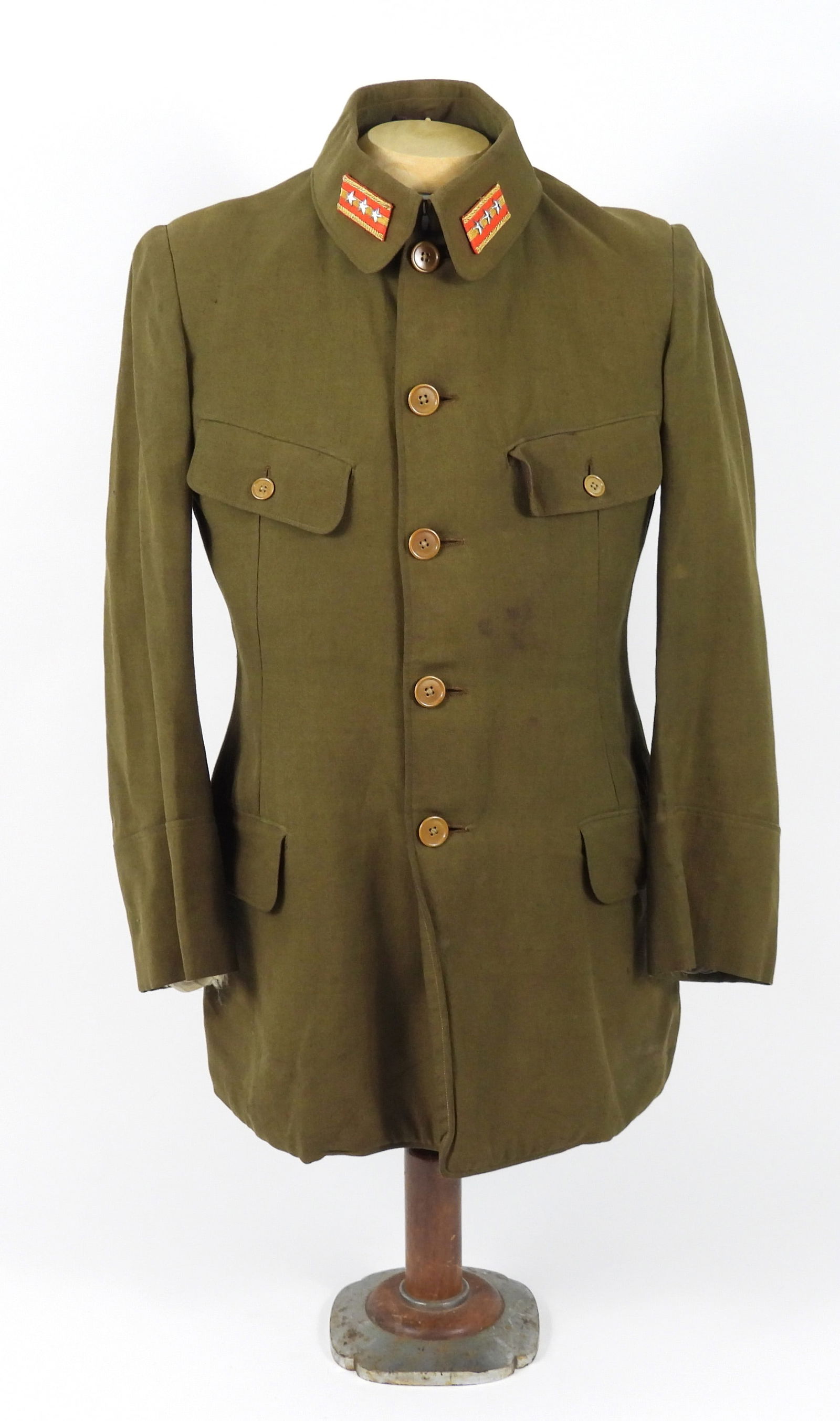 WWII Japanese M98 Officers Tunic: Japan. An OD lightweight twill woven tunic with external pocket flaps, light brown plastic buttons, collar insignia, and brown twill woven lining material.