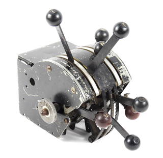 WWII-Era AT-17 Bobcat Throttle Quadrant: United States, Circa 1940s. Aircraft engine power controls with air & fuel mixture levers. Includes the original mounting bracket housing. Green paint beneath the black exterior color. All levers func