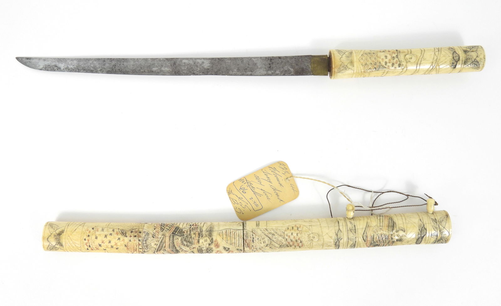 19C Japanese Carved Bone Sword: Japan, 19th Century, Bone, metal. Carved bone handle and sheath decorated with samurai and other figures.