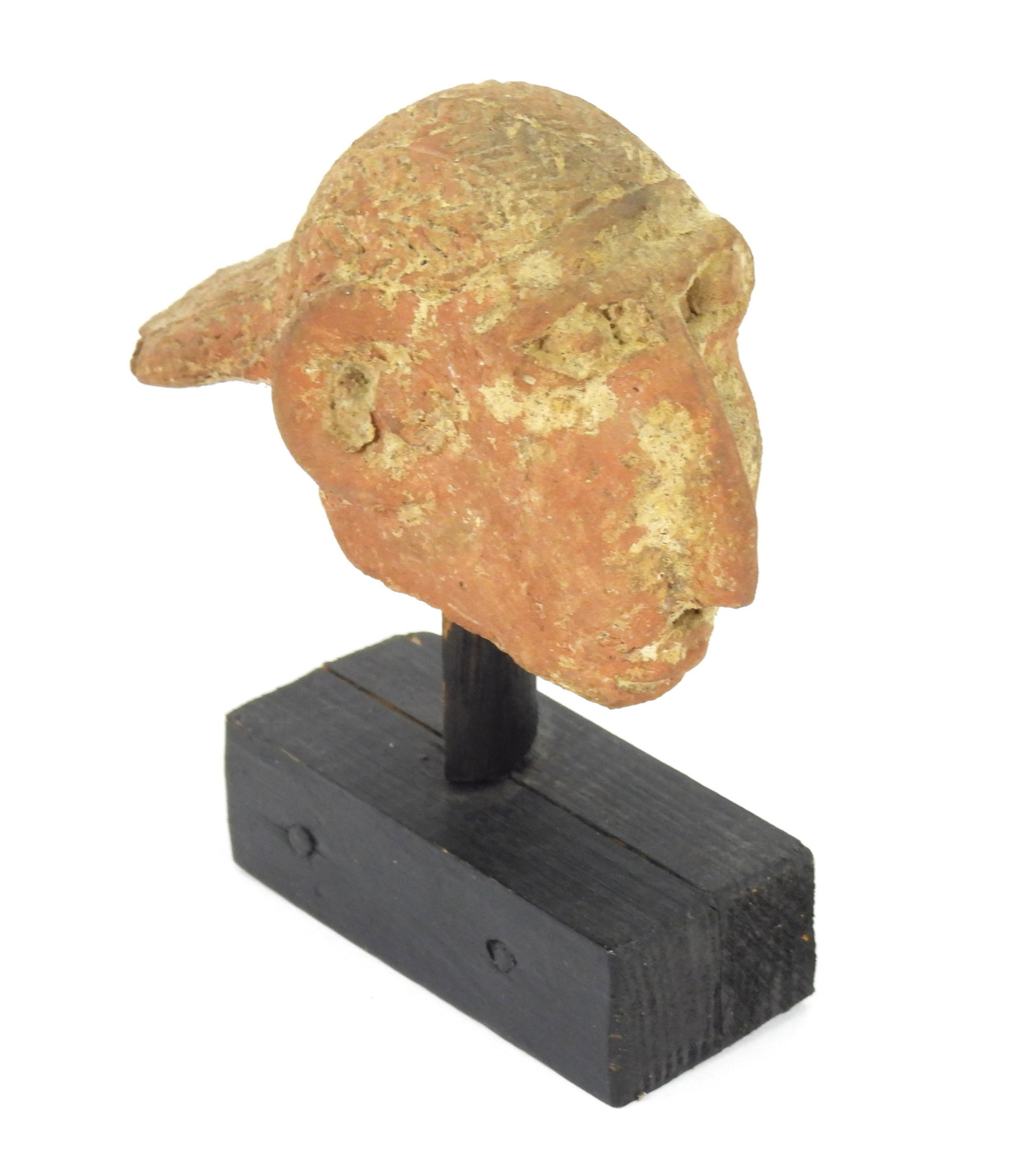 Ethiopian Falasha Terracotta Head: Ethiopa, Circa AD 400-700, Terracotta. Terracotta head fragment featuring a figure with braided hair, large eyes, and prominent nose. A similar example can be viewed in Sotheby's November 22, 2021 Art
