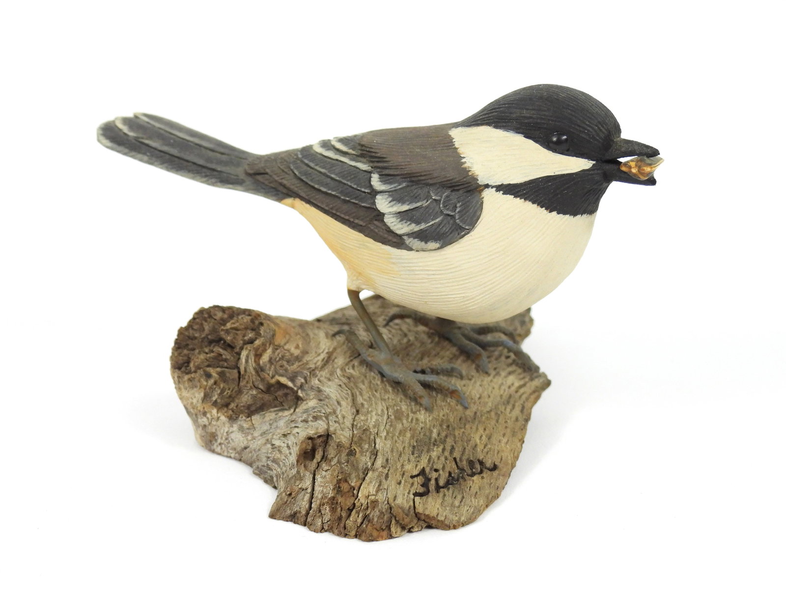 Randy & Elaine Fisher Chickadee Sculpture: Randy & Elaine Fisher, United States, Contemporary, Wood. Carved wood depiction of a chickadee holding a sunflower seed in its mouth.