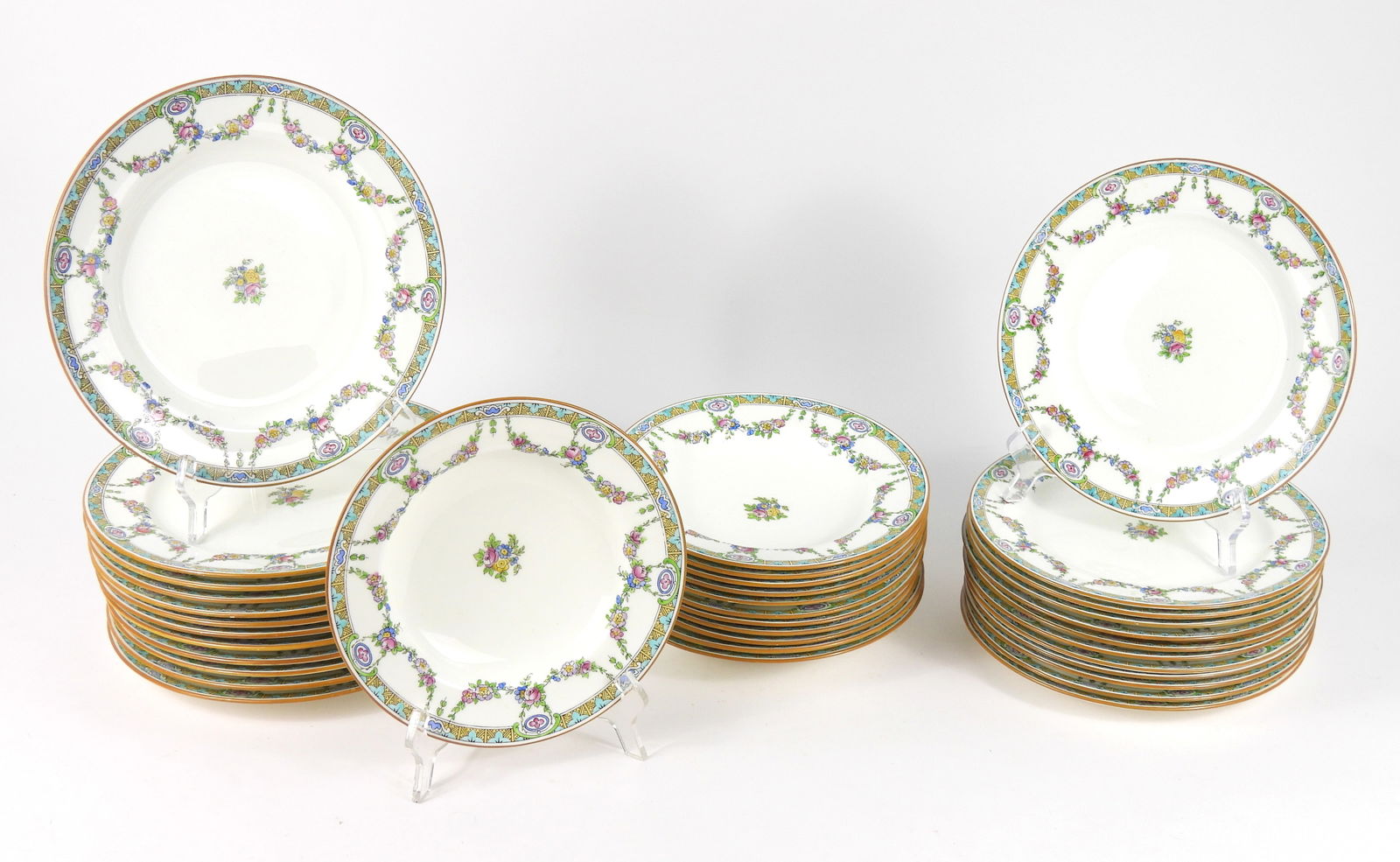36PC Minton B935 Botanical Porcelain Dinnerware: England, Circa 1930, Porcelain. Includes twelve dinner plates, twelve soup bowls, and twelve luncheon plates in the B935 pattern.