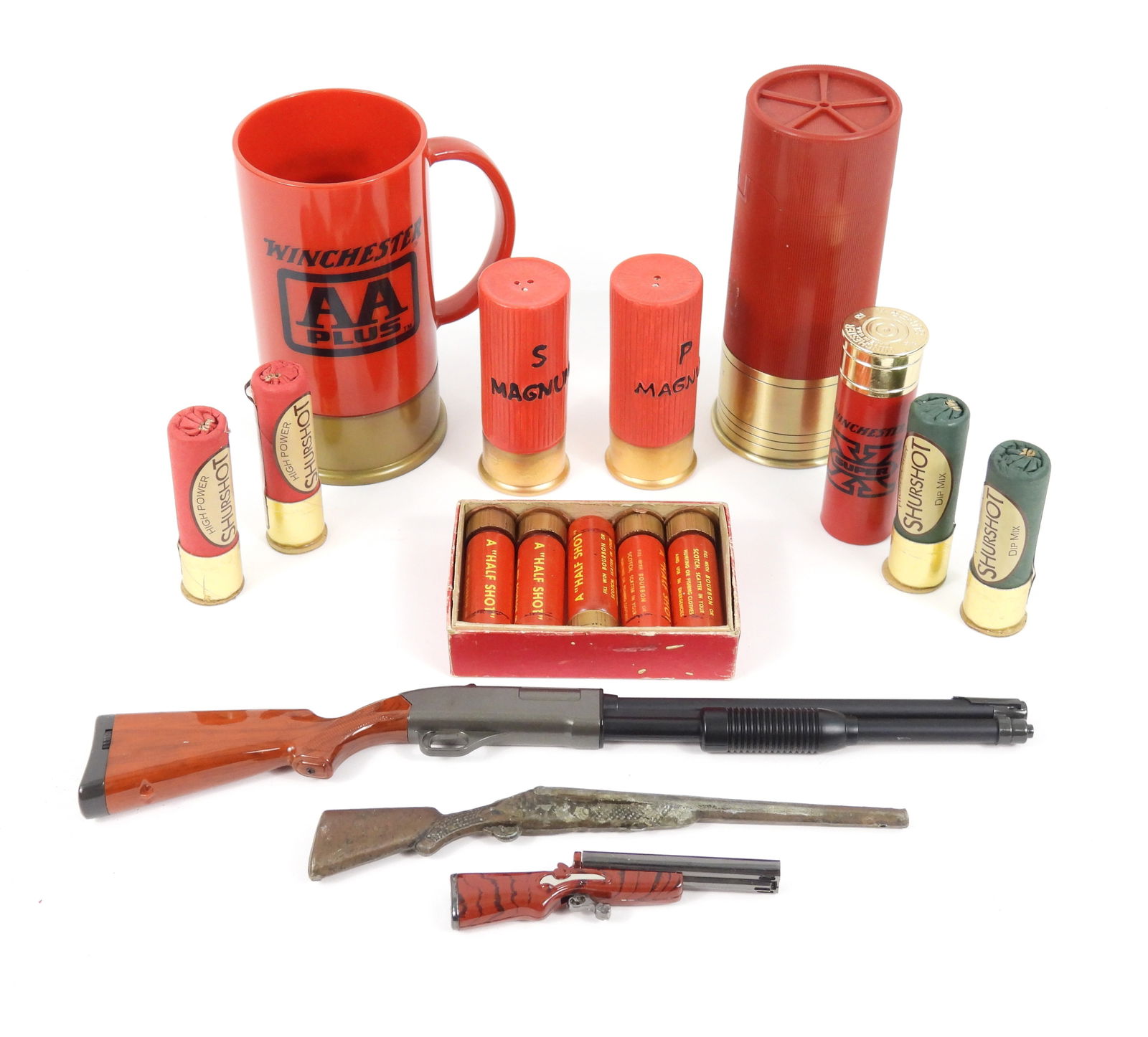 Collection of Shotgun Shell Collectibles: Includes various contemporary items to include a Winchester mug, after shave, Shotgun half shot nip canisters, Salt & Pepper shakers, 3 Lighters, and dip mix.
