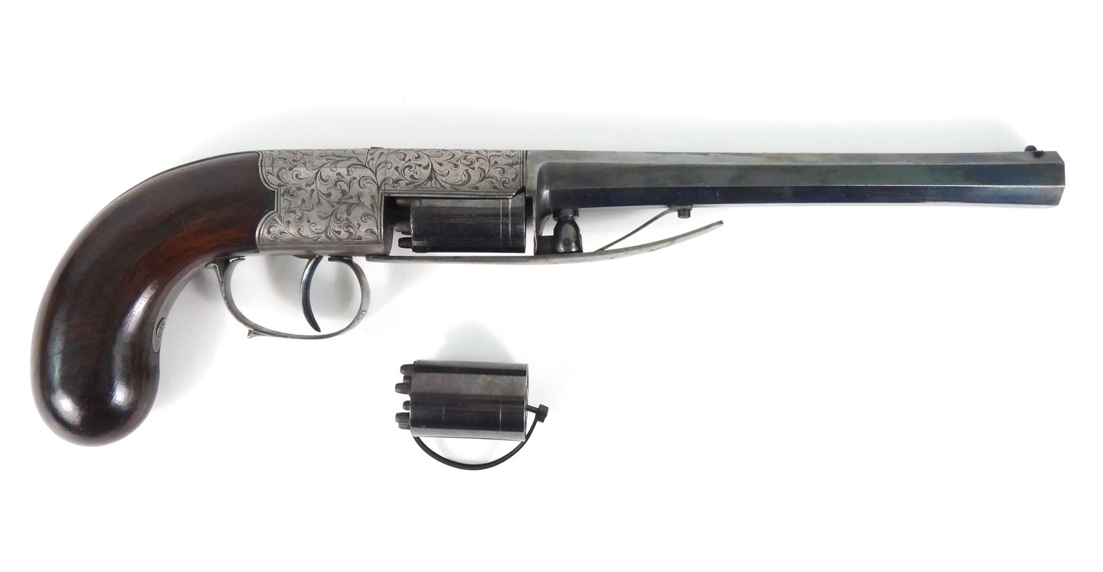 J.J. Herman Brevete Percussion Pistol & Cylinder: Approximate 7.9mm bore, serial number 22, walnut grip, steel frame and trigger guard engraved with foliate designs, back strap engraved with foliate designs and marked "J.J. HERMAN/BREVETE" in an oval