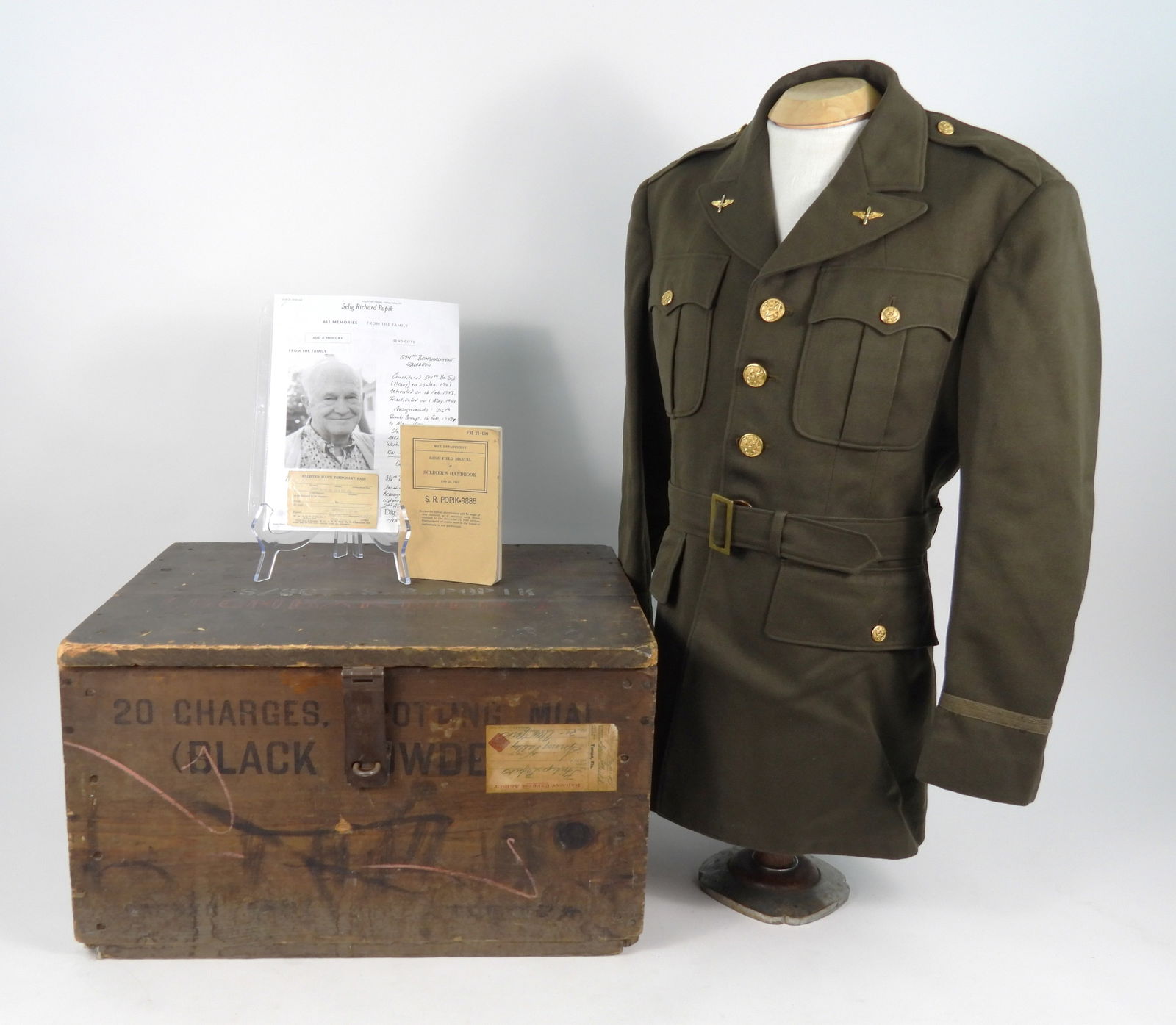 Selig R. Popik AAF Grouping: United States, C. 1943-44. Wooden M1A1 black powder spotting charges crate marked on the lid "594 SQ./S/SGT. S.R. POPIK/(BOMBARDIER)" with a shipping label on the front of the crate when Popik sent it