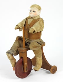 19C Bisque Head Bike Riding Boy Doll