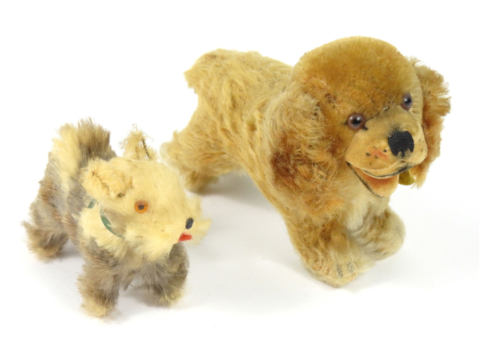 2PC Steiff Cockie & German Rabbit Fur Dog: Germany, Mid 20th Century, Mohair, fur. Includes a Steiff "Cockie" blonde cocker spaniel with swivel head and glass eyes, and a rabbit fur terrier with a green harness retaining a "U.S.Z. Germany"