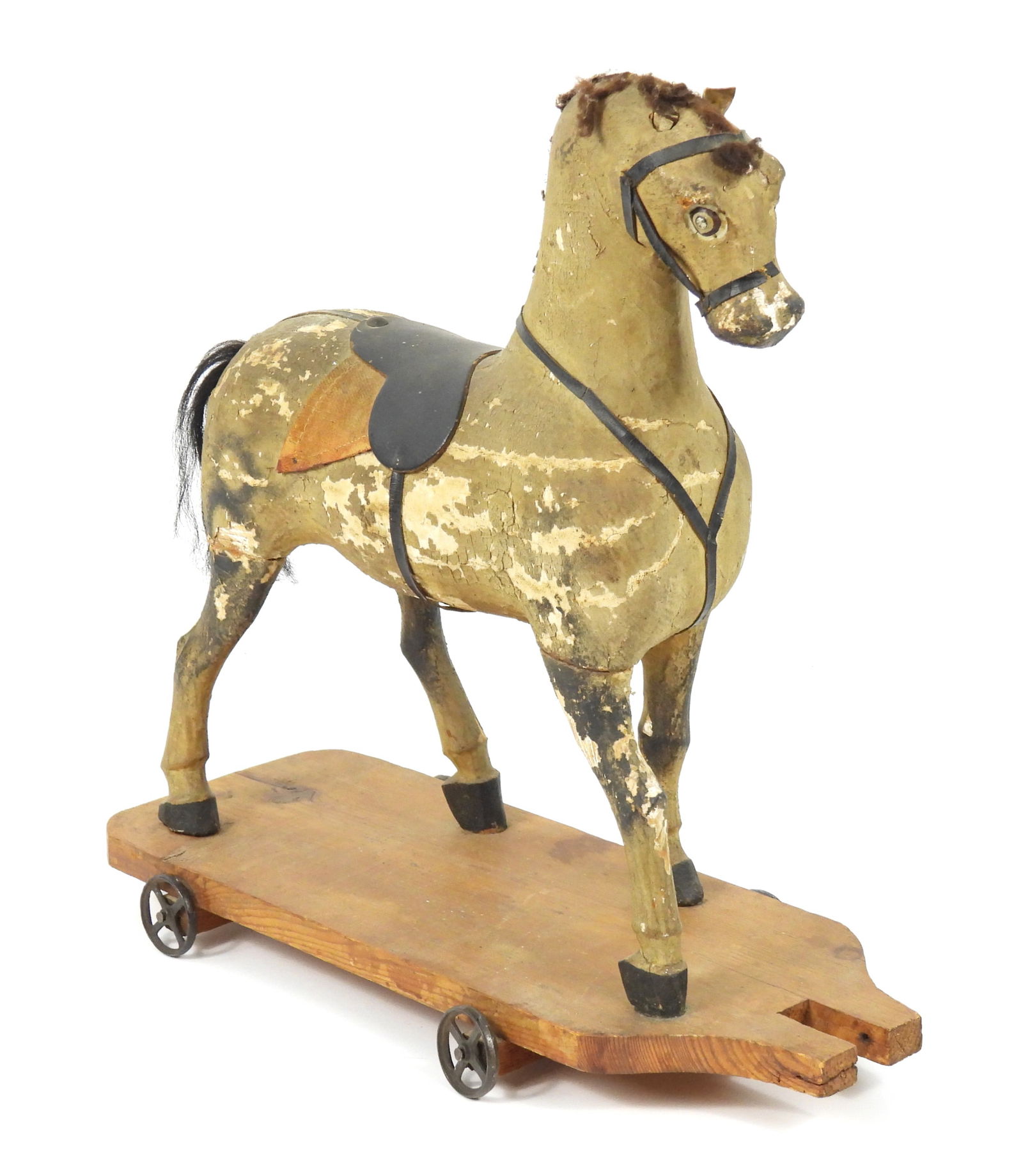 19C German Wood Horse Pull Toy: Germany, 19th Century, Wood, textile. White and black horse pull toy with black saddle and harness on a wood base. Approx. 15" t x 15" w x 6 3/8" d